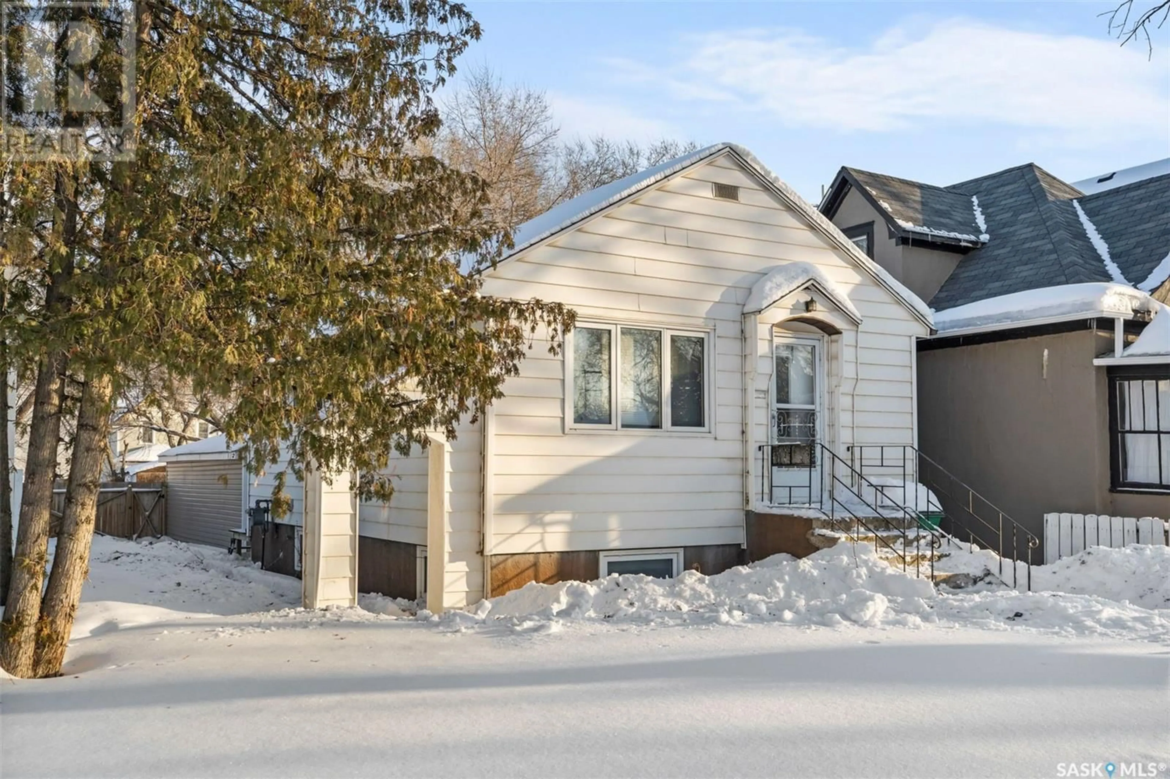 Home with vinyl exterior material, street for 134 G AVENUE N, Saskatoon Saskatchewan S7I1Y8