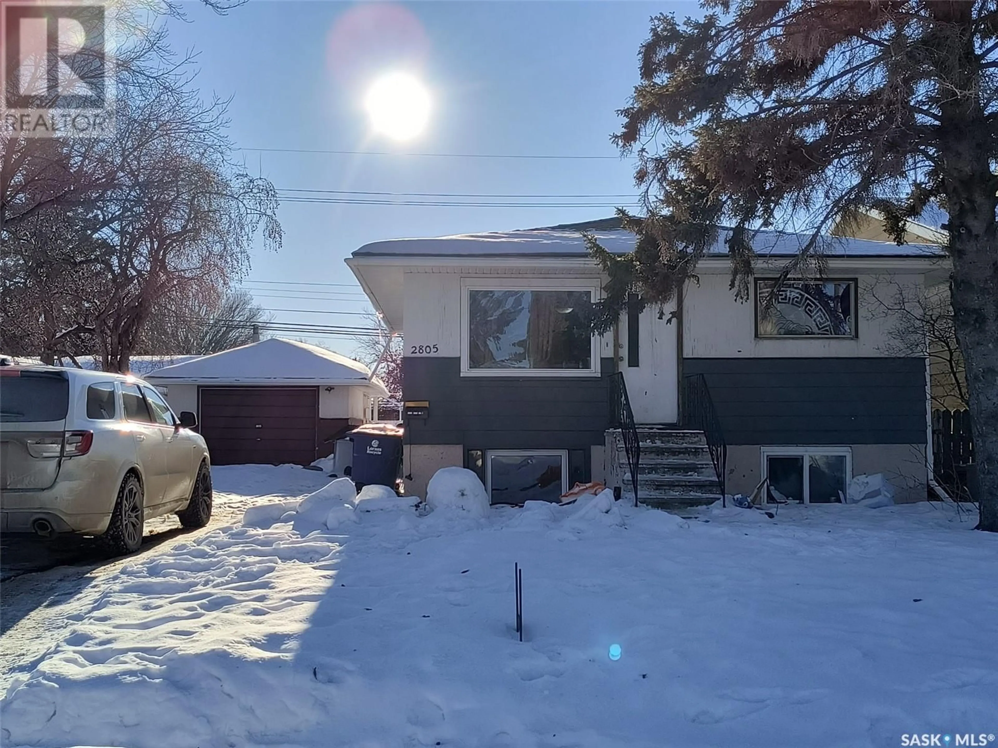 Home with vinyl exterior material, street for 2805 20TH STREET, Saskatoon Saskatchewan S7M1B9