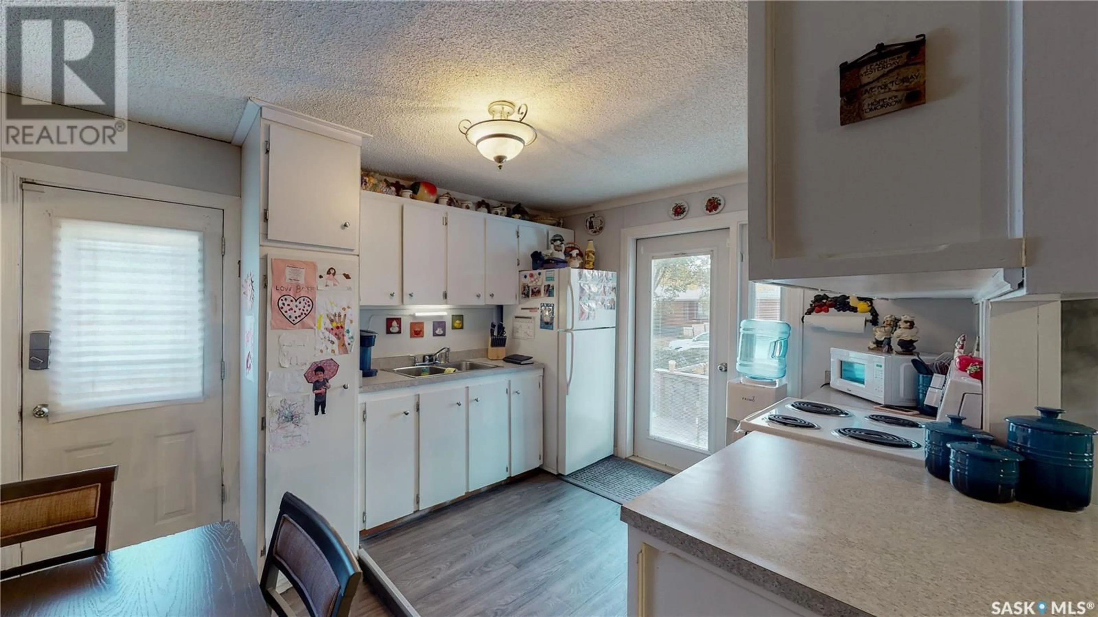 Open concept kitchen, ceramic/tile floor for 480 Smith STREET, Regina Saskatchewan S4R2L2