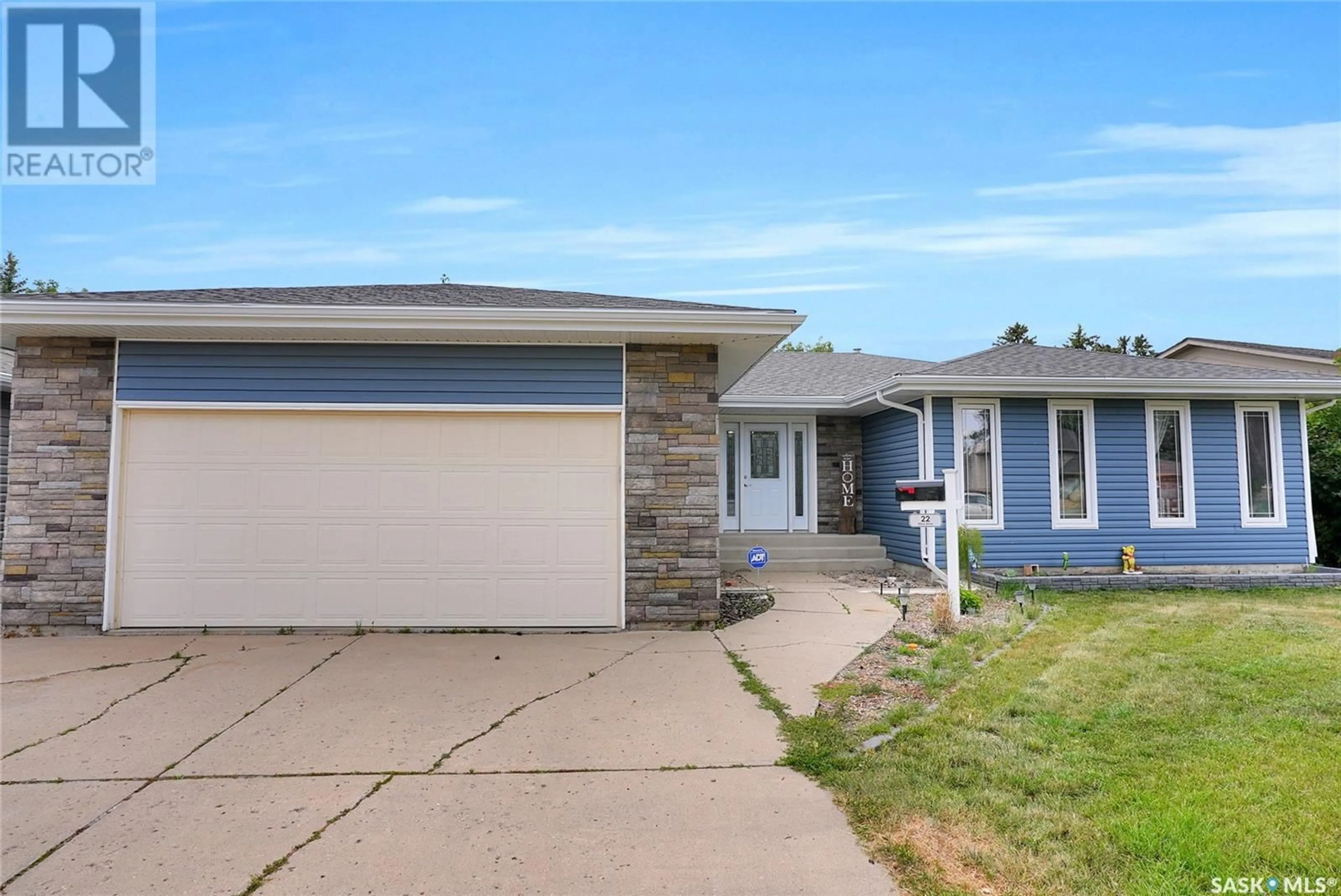 Home with vinyl exterior material, street for 22 ELISIA DRIVE, Moose Jaw Saskatchewan S6J1G9