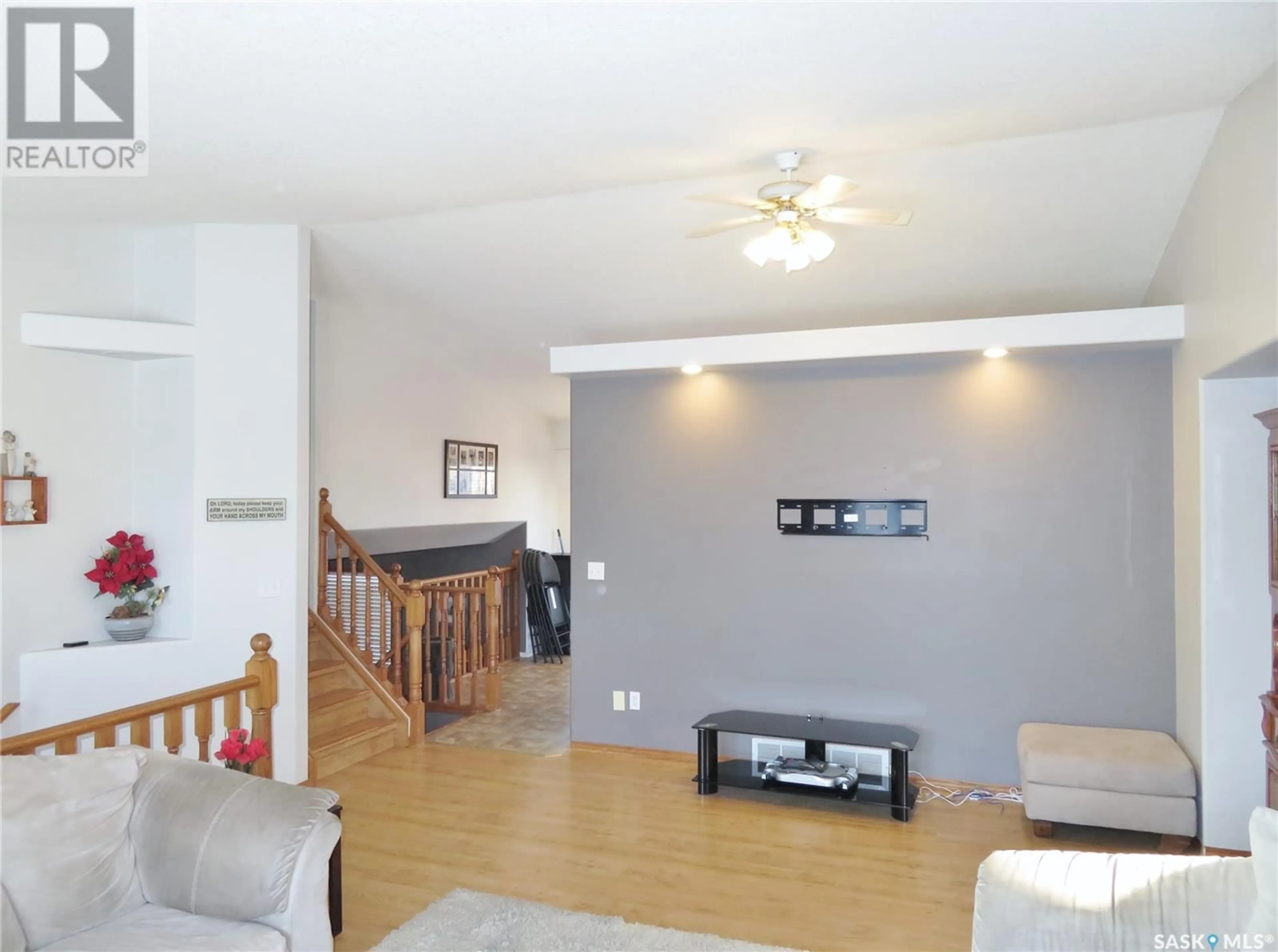 Living room with furniture, wood/laminate floor for 339 Coben CRESCENT, Saskatoon Saskatchewan S7S1B5