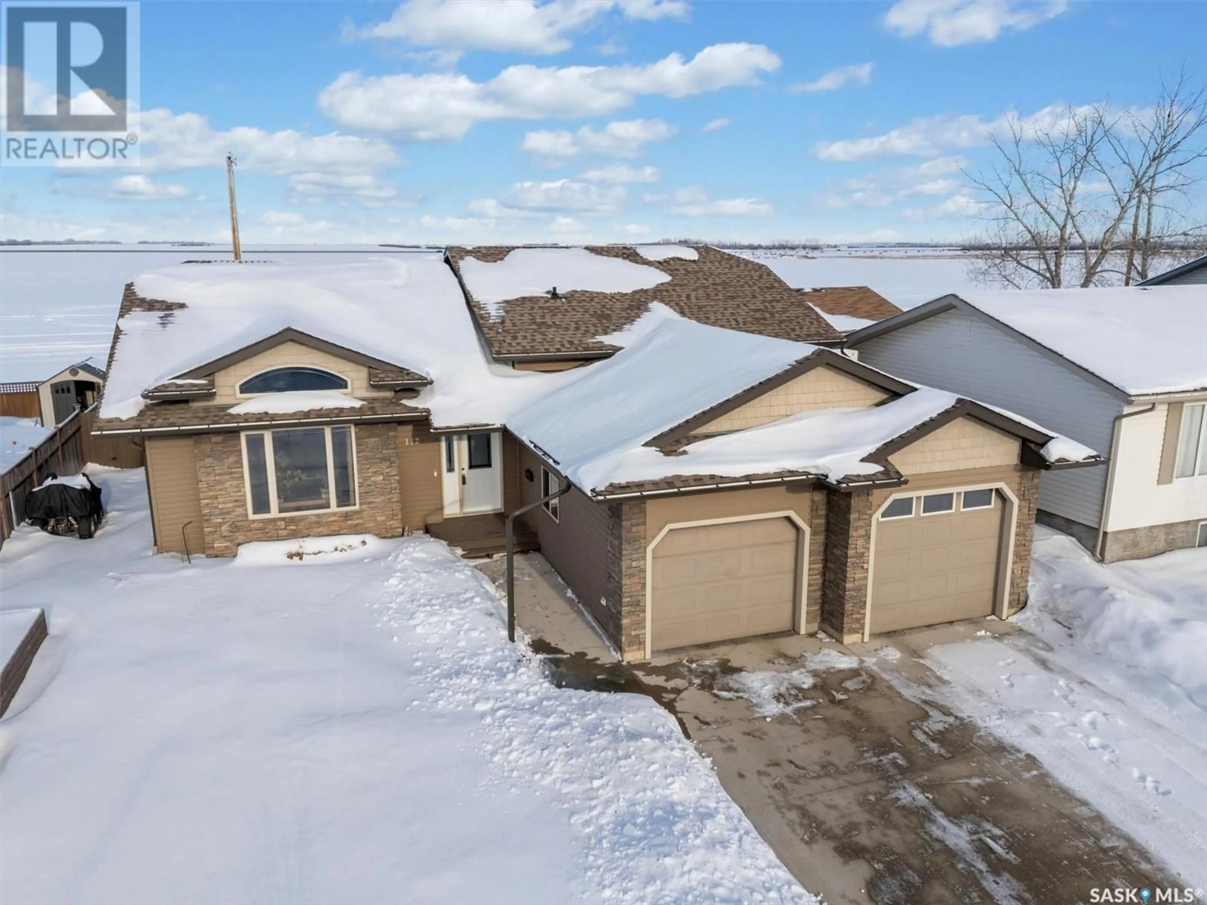 A pic from outside/outdoor area/front of a property/back of a property/a pic from drone, street for 112 Willard DRIVE, Vanscoy Saskatchewan S0L3J0