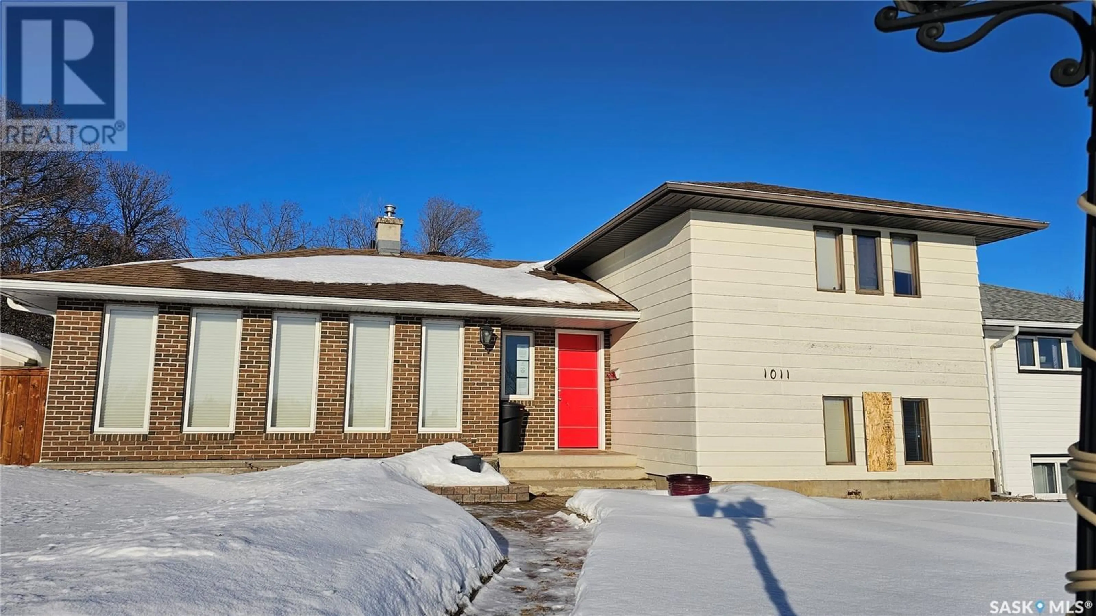 Home with brick exterior material, street for 1011 North Hill DRIVE, Swift Current Saskatchewan S9H1X7