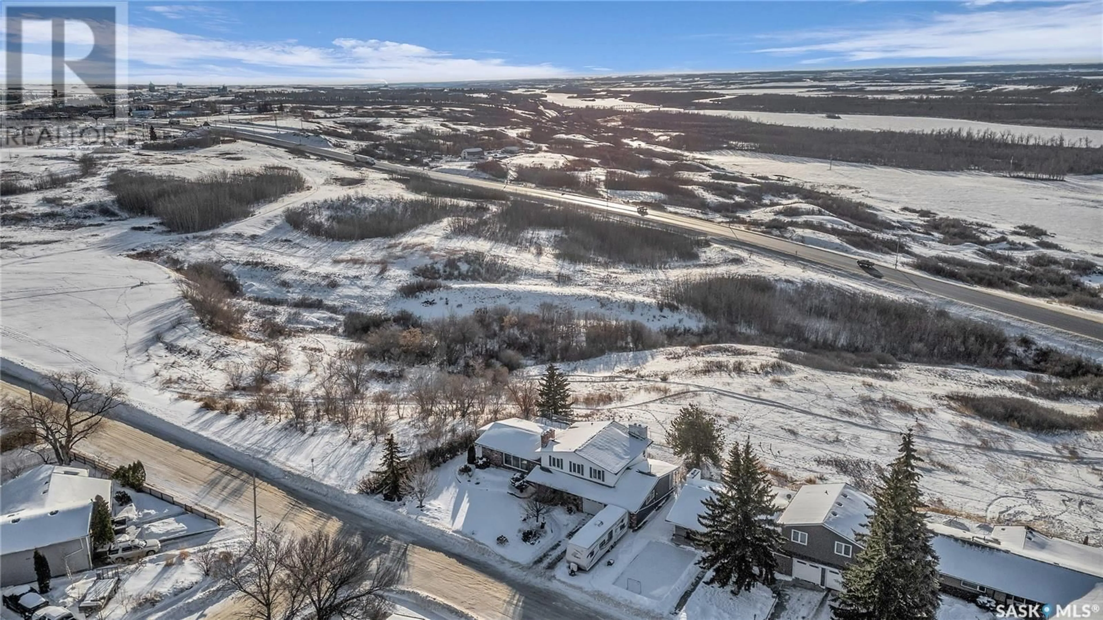 A pic from outside/outdoor area/front of a property/back of a property/a pic from drone, mountain view for 10008 5th AVENUE, North Battleford Saskatchewan S9A2N2