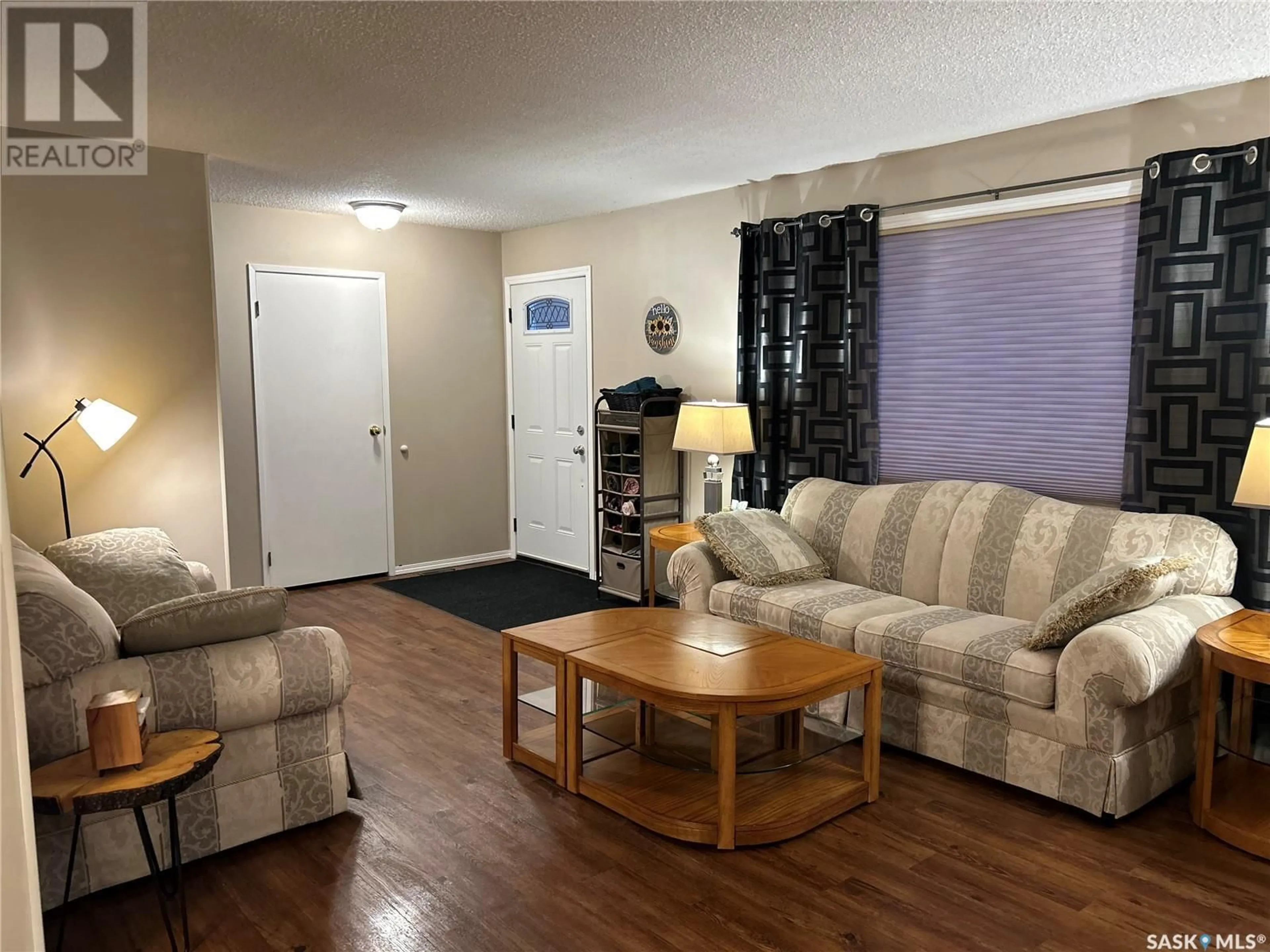 Living room with furniture, wood/laminate floor for 36 Centennial CRESCENT, Humboldt Saskatchewan S0K2A0