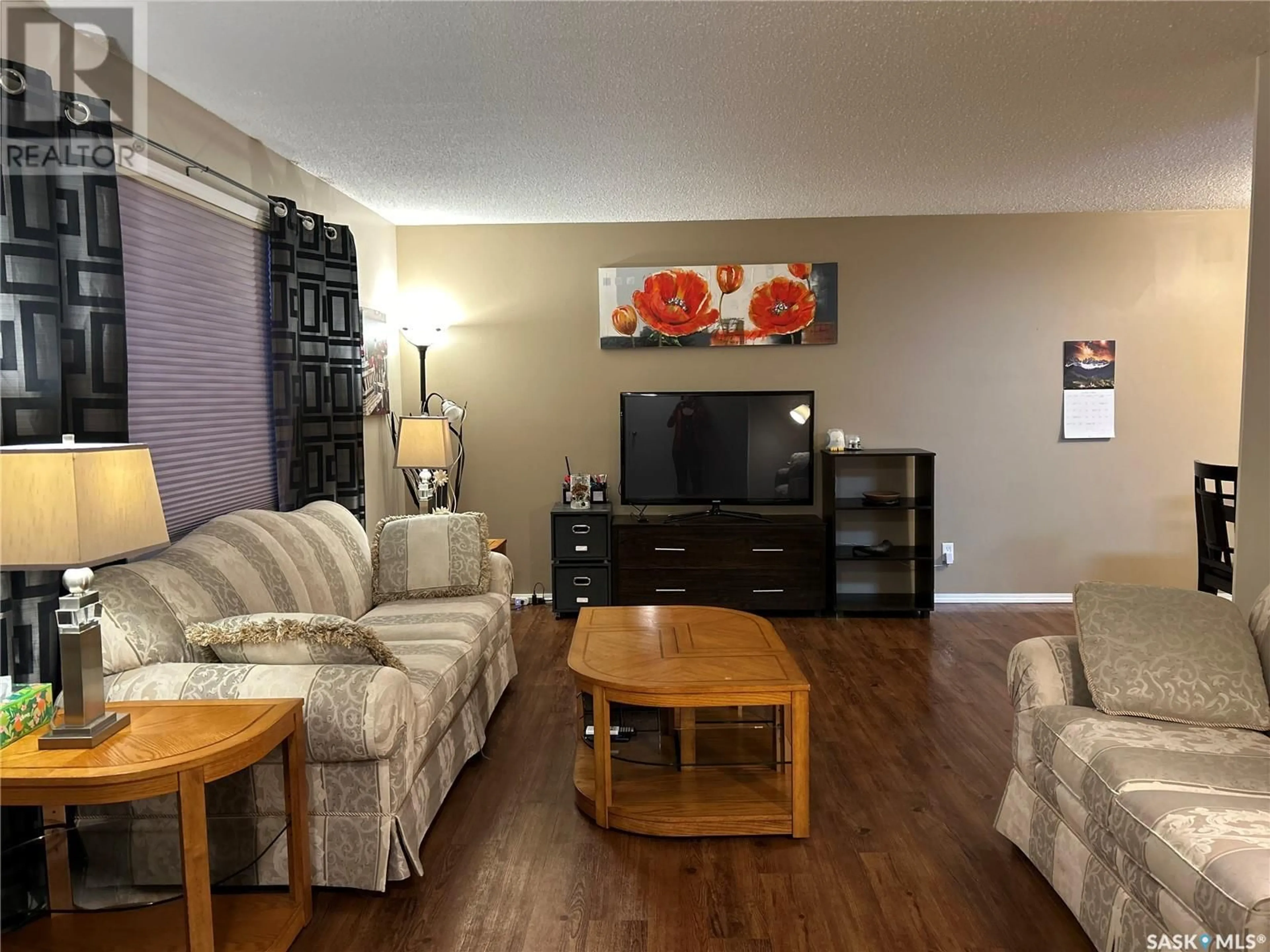 Living room with furniture, wood/laminate floor for 36 Centennial CRESCENT, Humboldt Saskatchewan S0K2A0