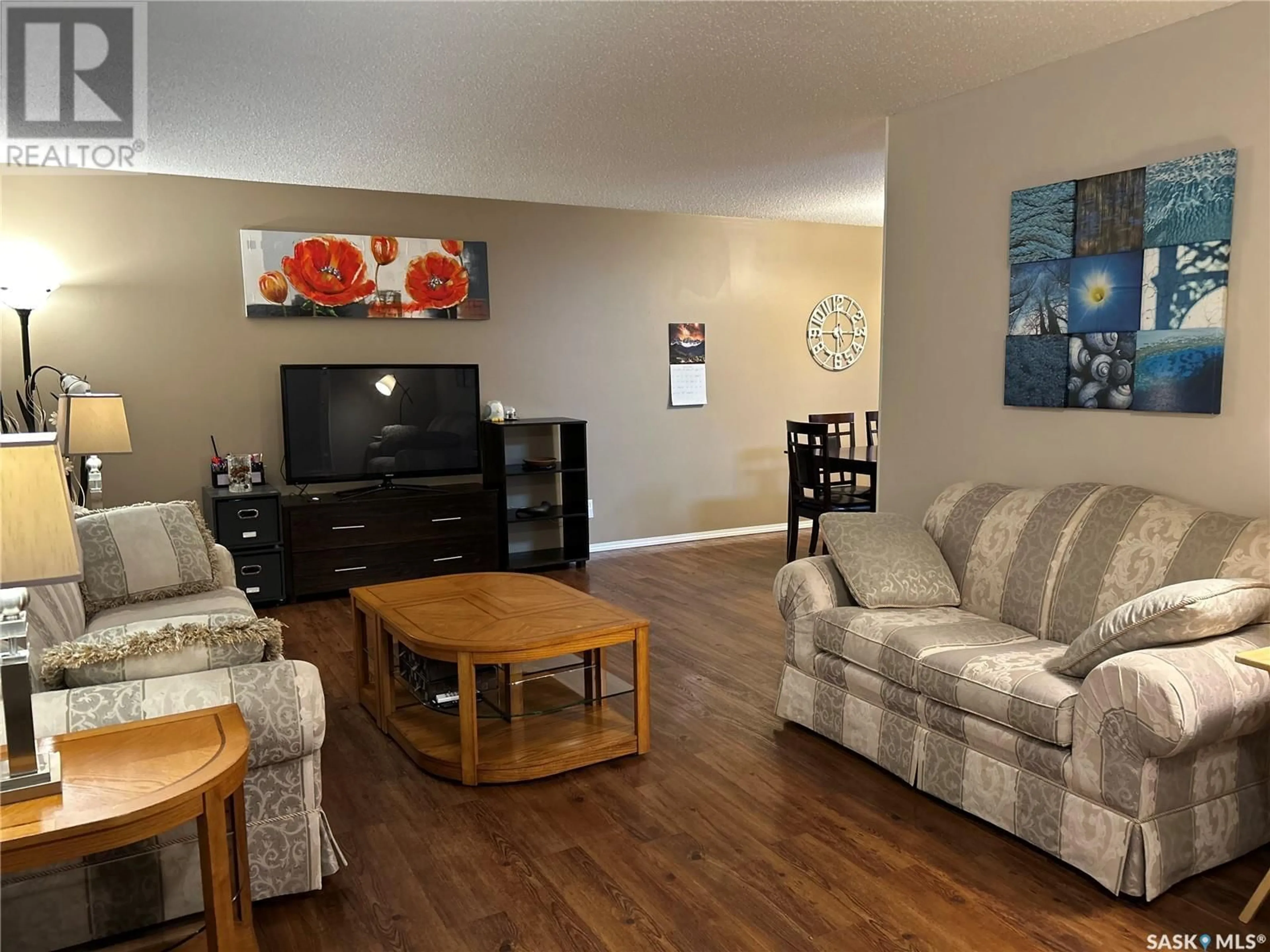 Living room with furniture, wood/laminate floor for 36 Centennial CRESCENT, Humboldt Saskatchewan S0K2A0