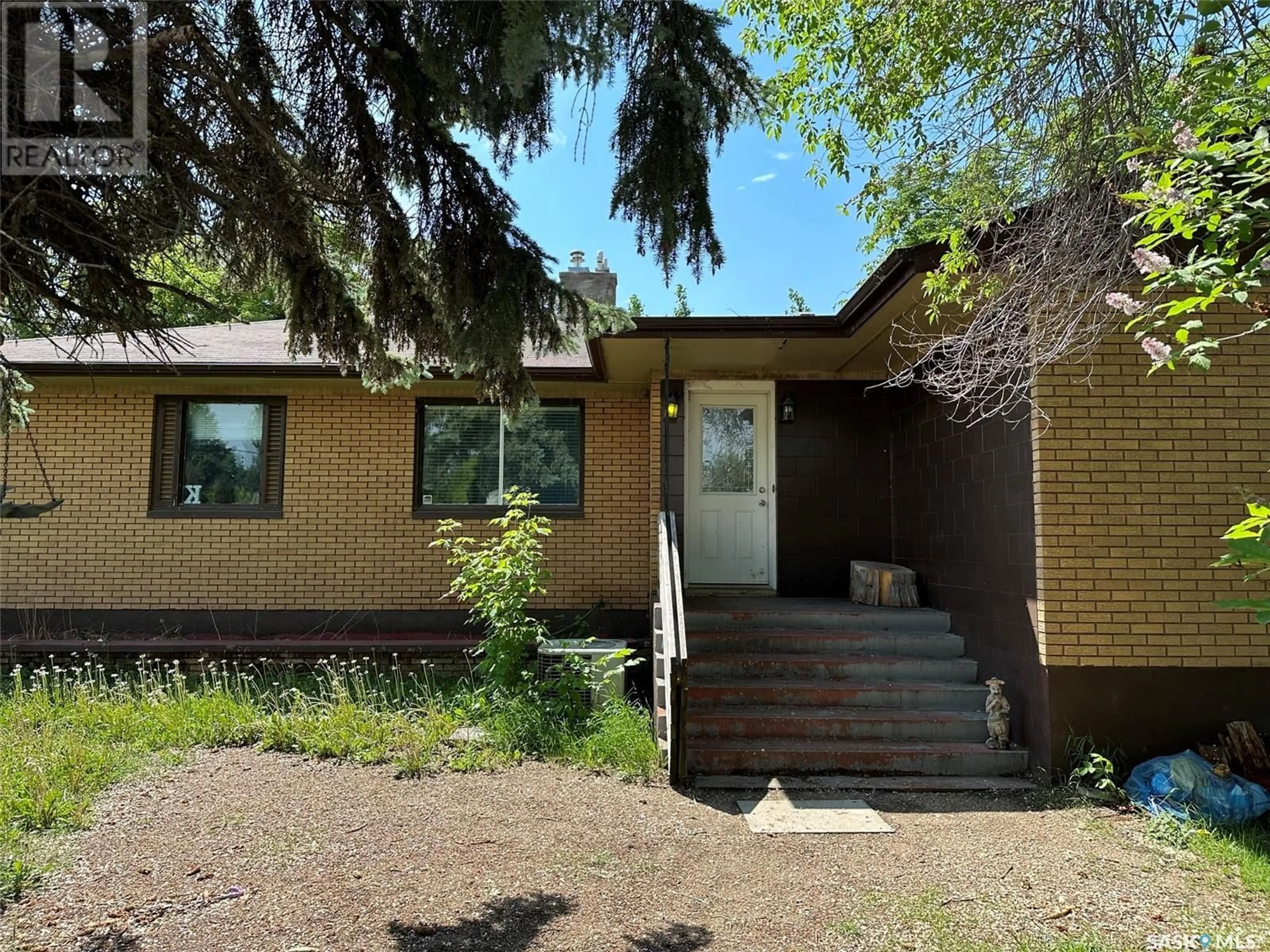 Home with brick exterior material, street for 502 1st STREET W, Meadow Lake Saskatchewan S9X1E5