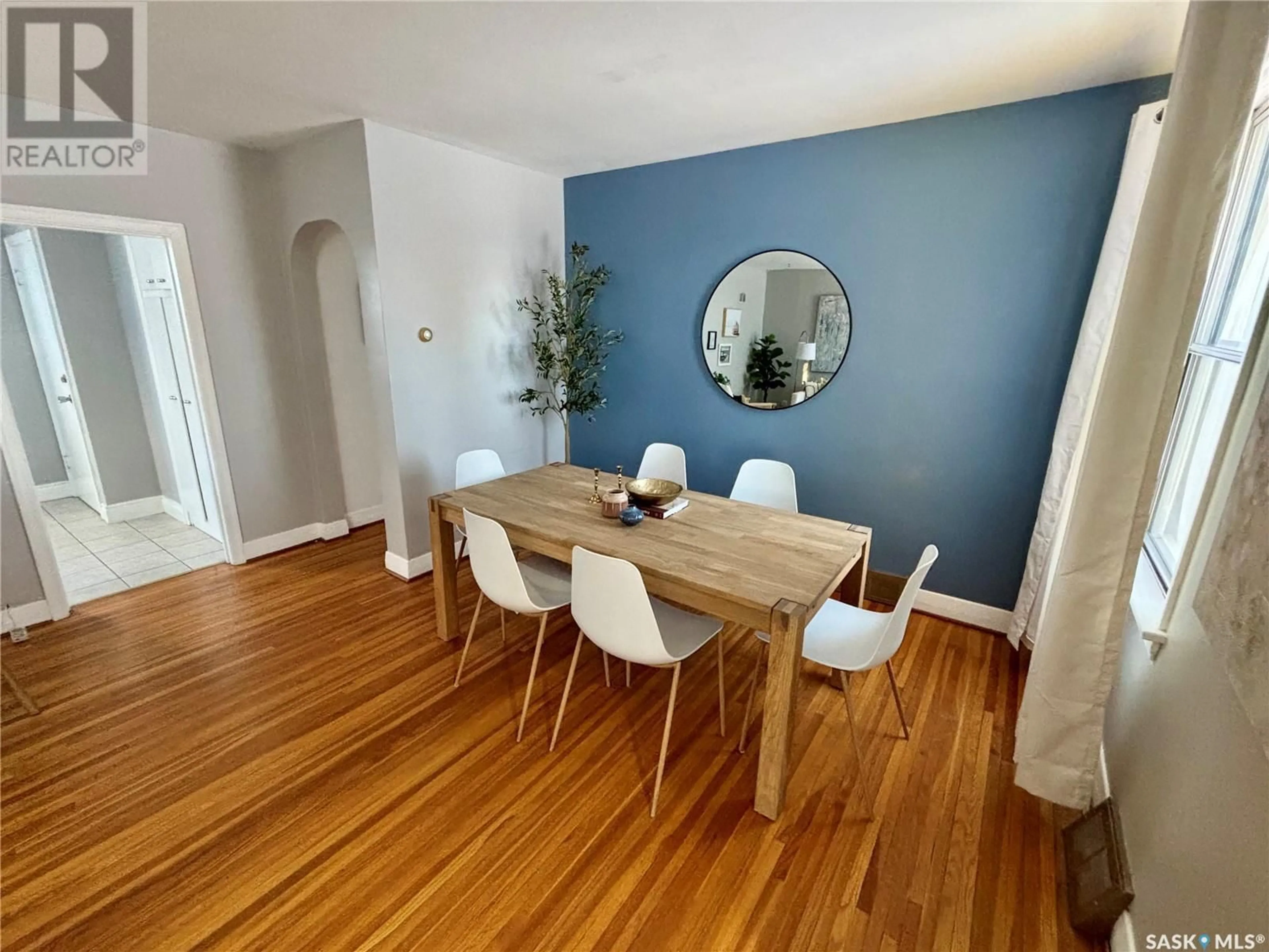 Dining room, wood/laminate floor for 1117 Wiggins AVENUE S, Saskatoon Saskatchewan S7H2J4