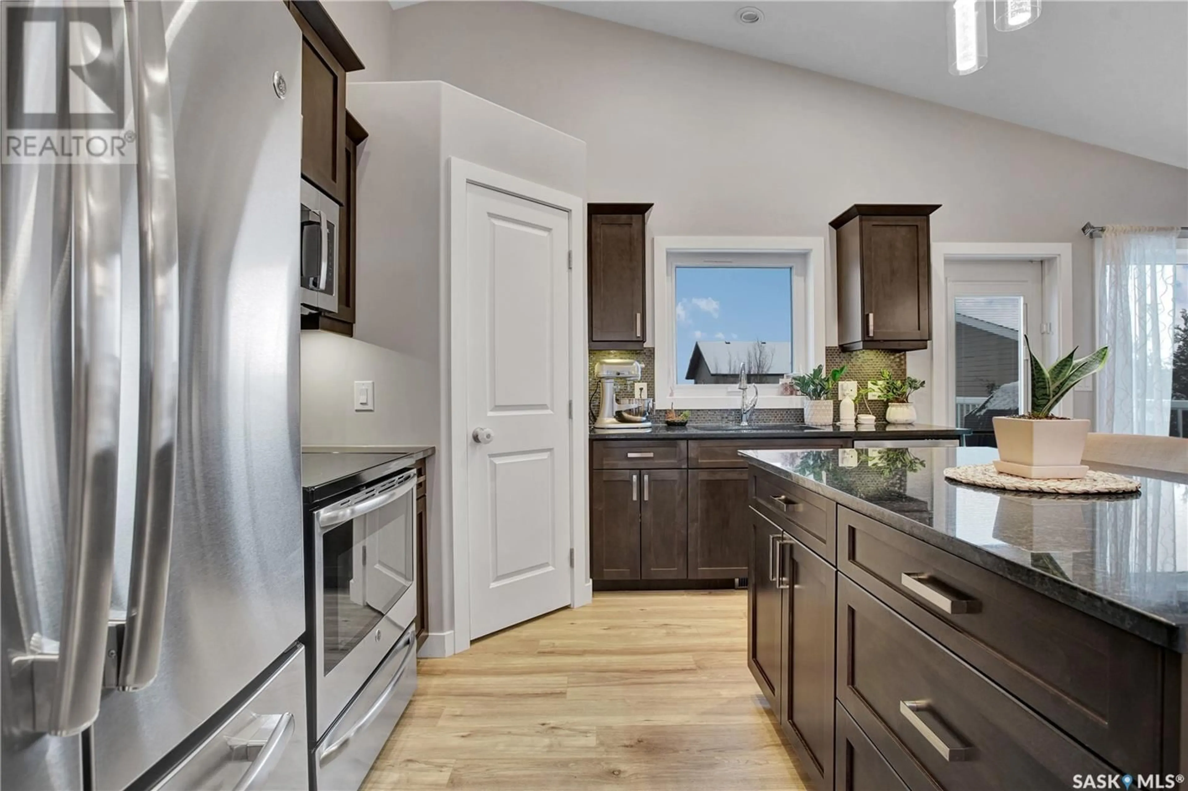 Open concept kitchen, unknown for 513 Snead LANE, Warman Saskatchewan S0K4S1