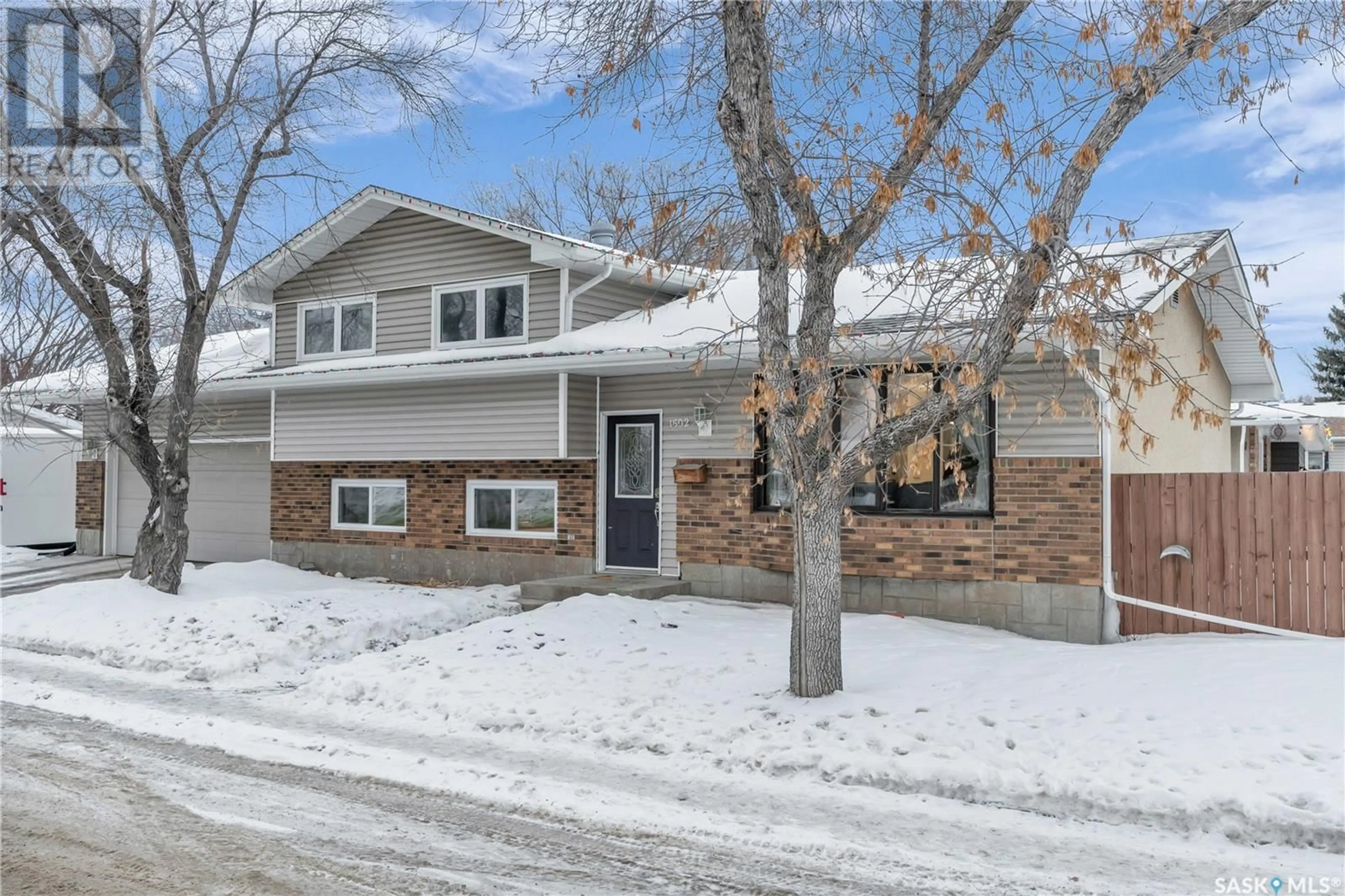 Home with brick exterior material, street for 1502 12th AVENUE N, Regina Saskatchewan S4R6Y4