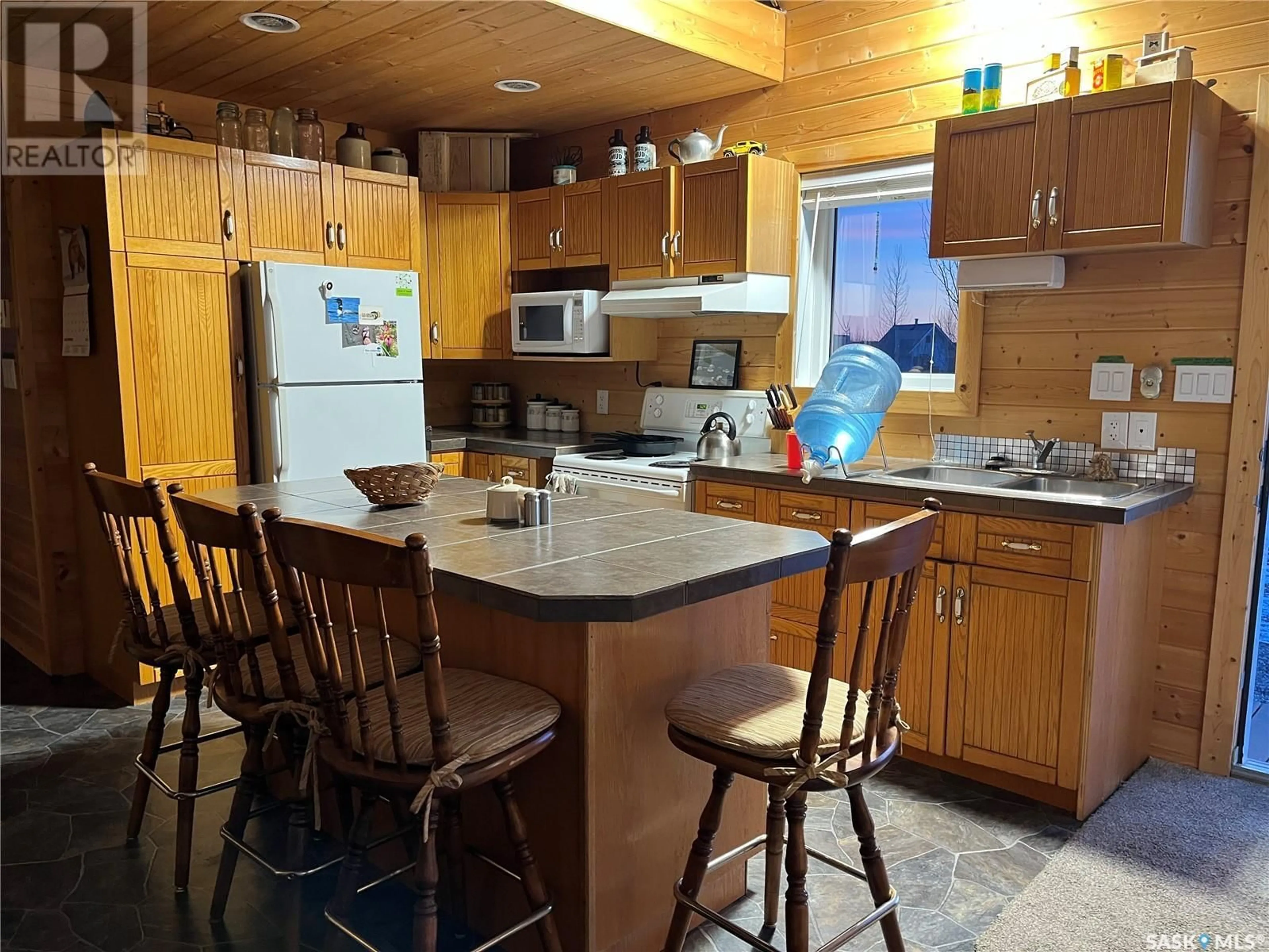 Open concept kitchen, wood/laminate floor for 16 Porcupine DRIVE, Delaronde Lake Saskatchewan S0J0E0