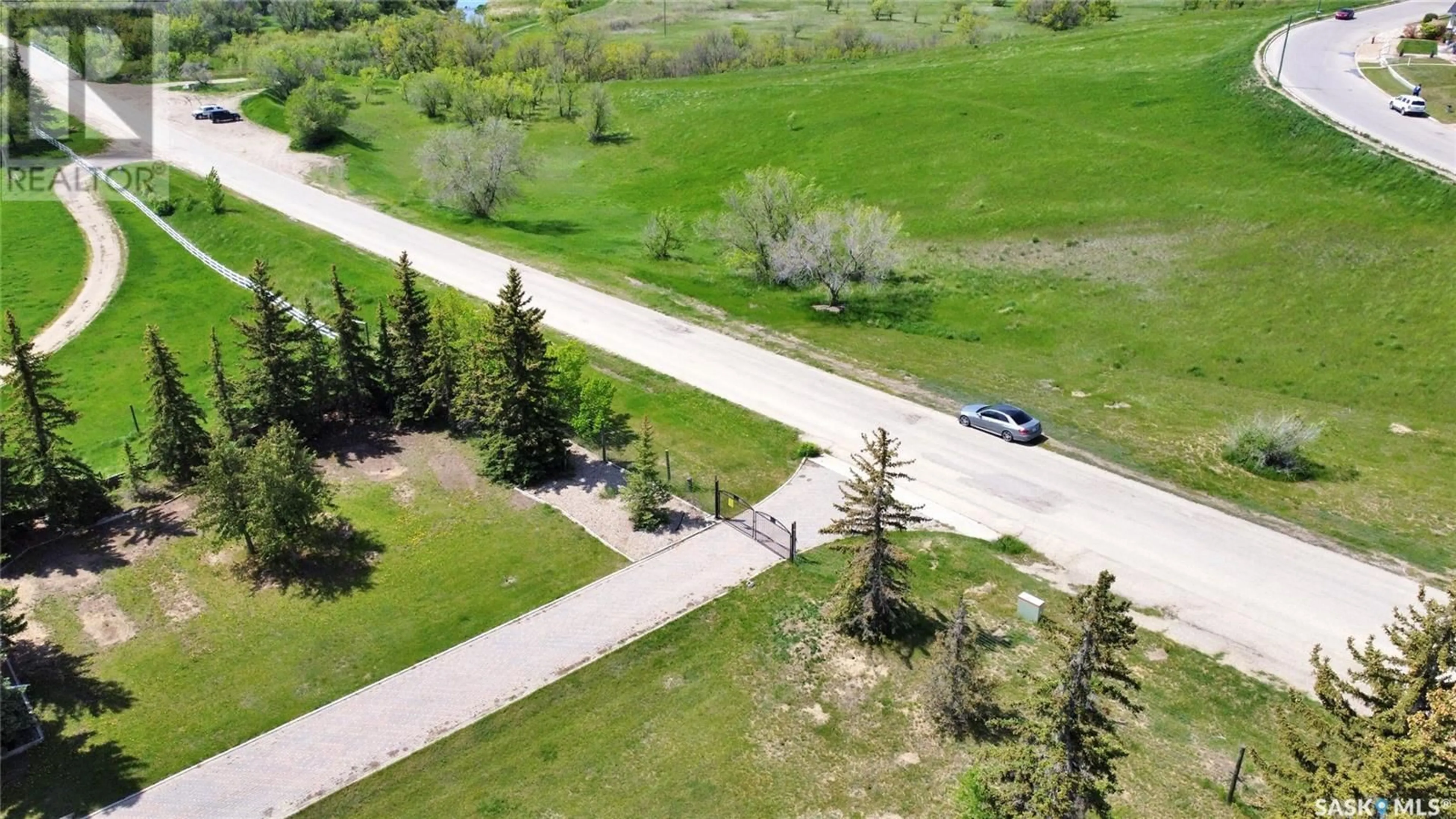 A pic from outside/outdoor area/front of a property/back of a property/a pic from drone, street for 1055 7th AVENUE SW, Moose Jaw Saskatchewan S6H5R2