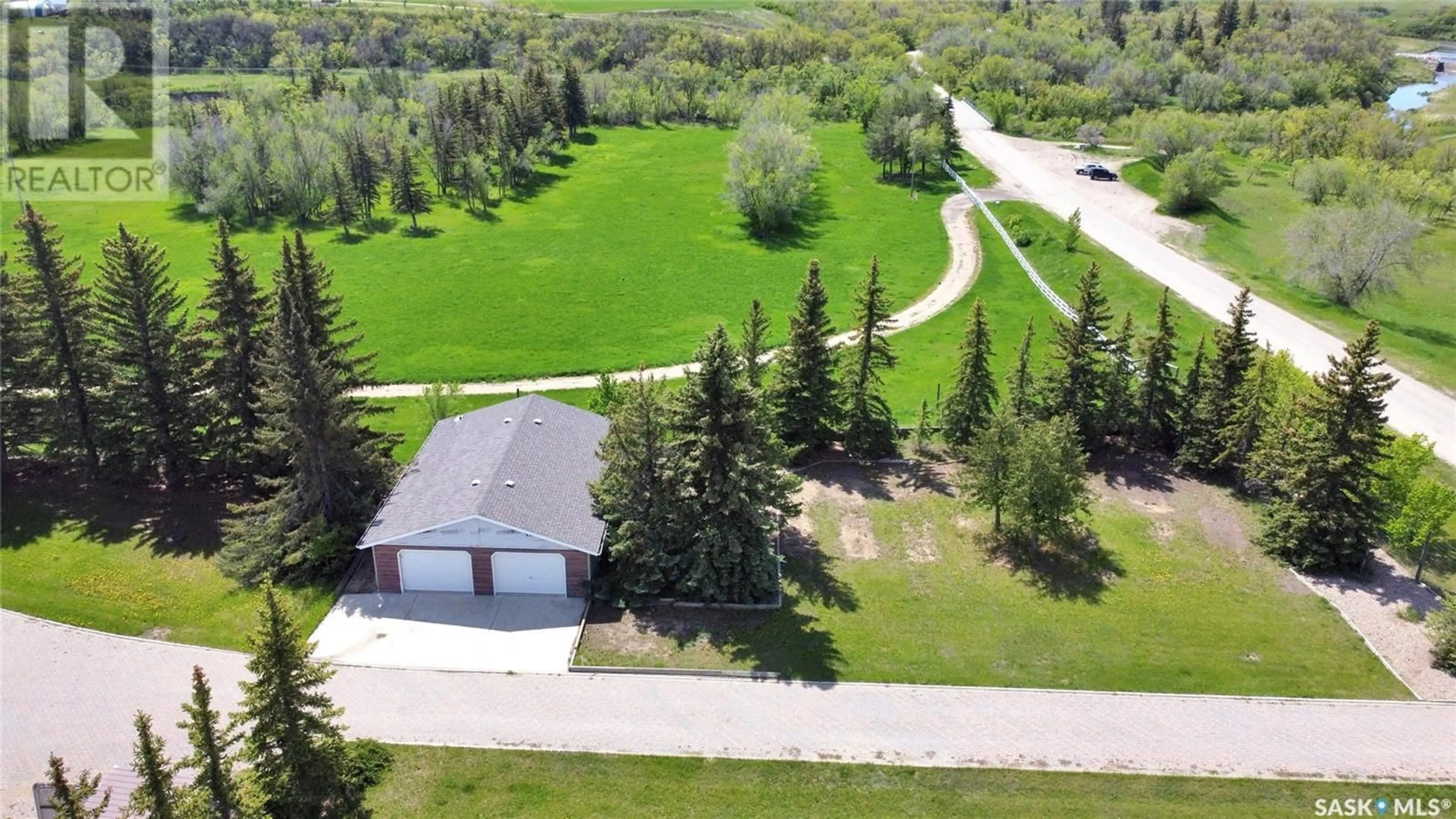 A pic from outside/outdoor area/front of a property/back of a property/a pic from drone, street for 1055 7th AVENUE SW, Moose Jaw Saskatchewan S6H5R2