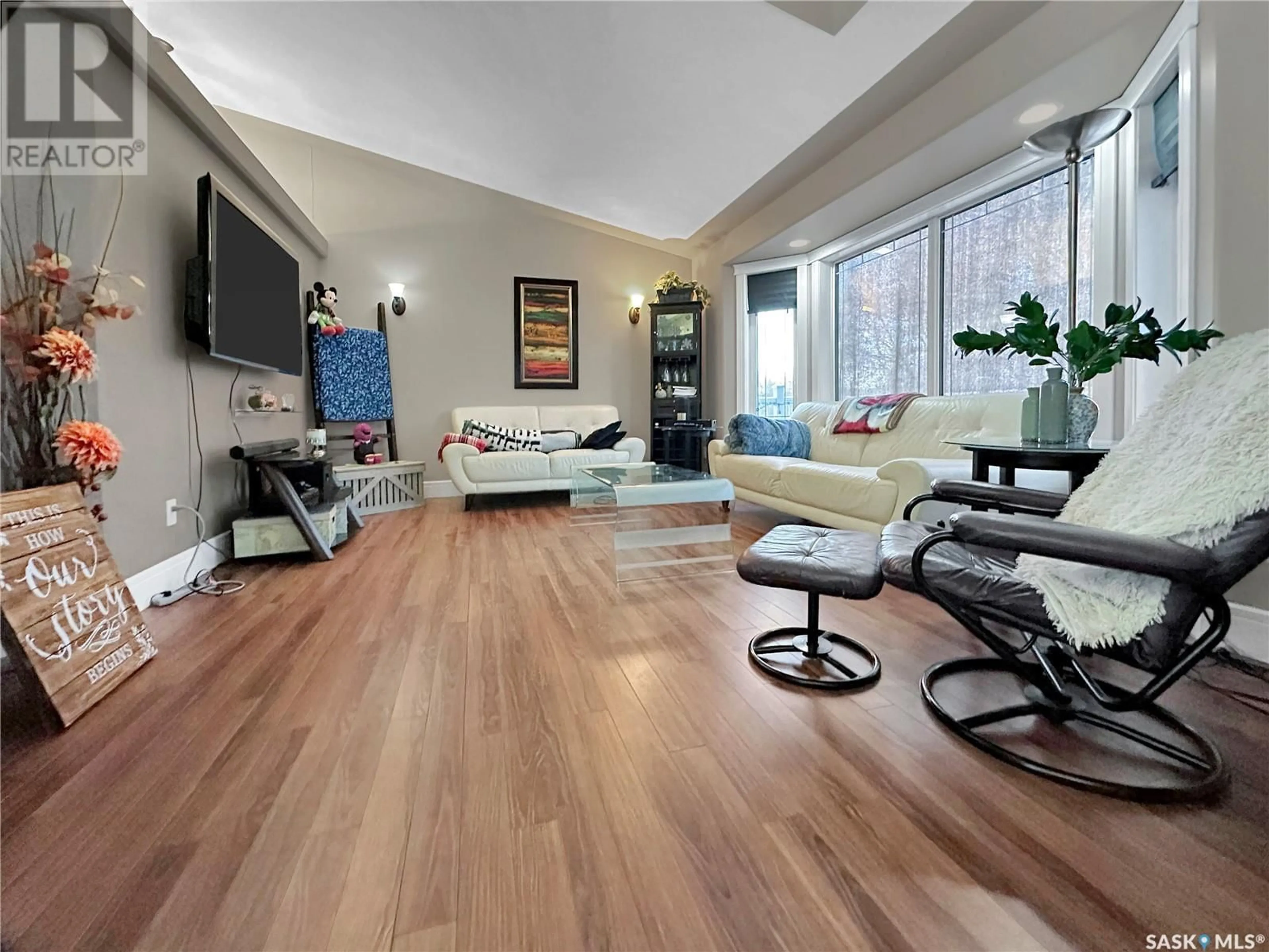 Living room with furniture, wood/laminate floor for 317 IVY HEIGHTS, Crooked Lake Saskatchewan S0G5L0