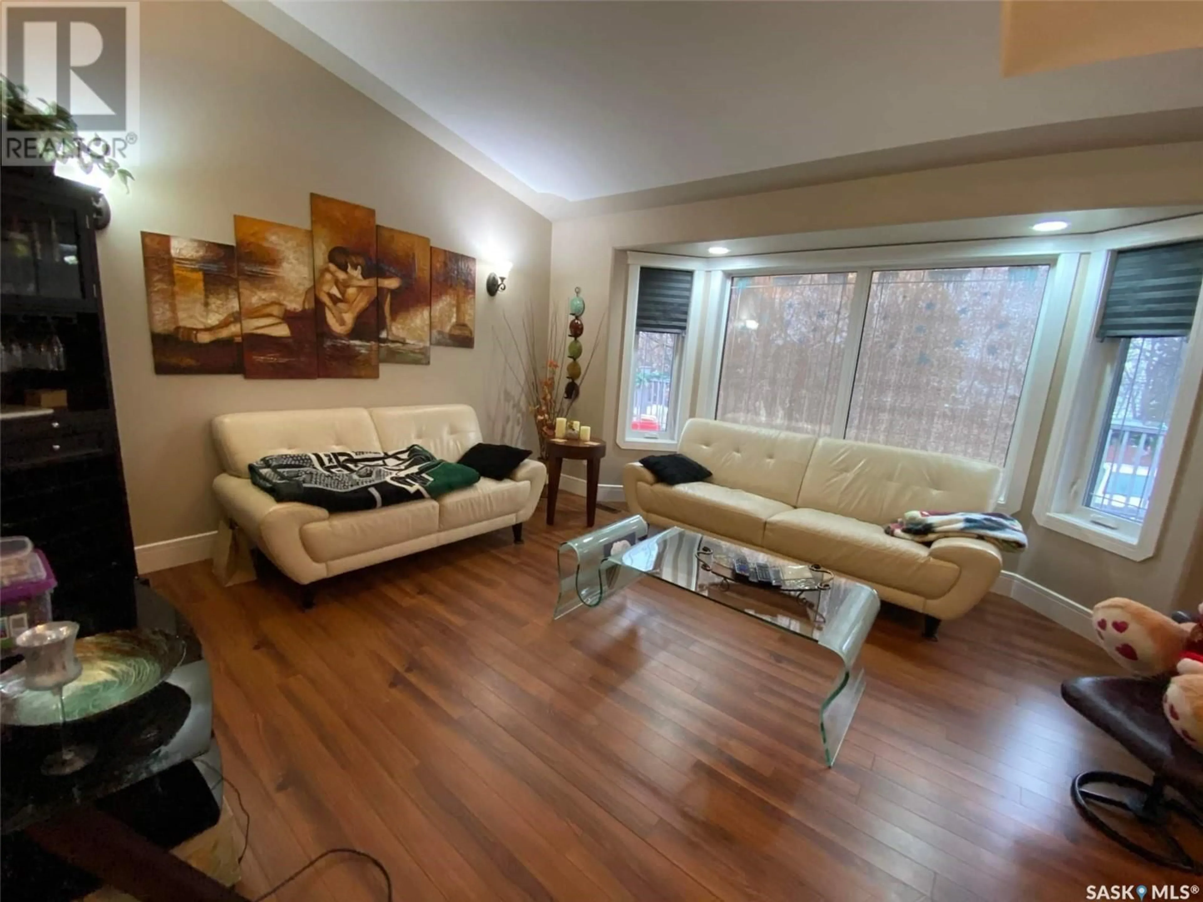 Living room with furniture, wood/laminate floor for 317 Ivy HEIGHTS, Crooked Lake Saskatchewan S0G5L0