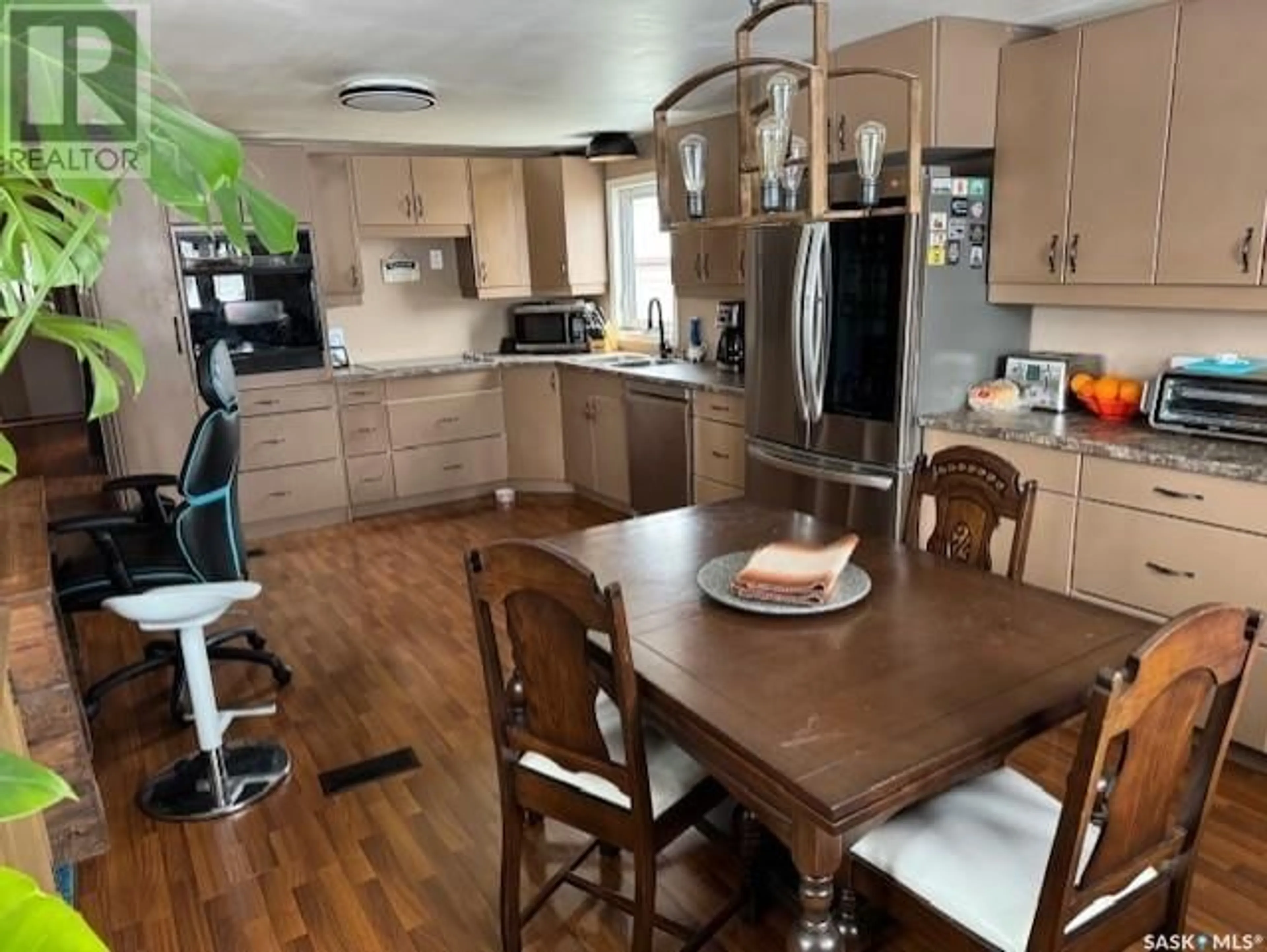 Open concept kitchen, wood/laminate floor for 416 2nd AVENUE, Martensville Saskatchewan S0K2T0