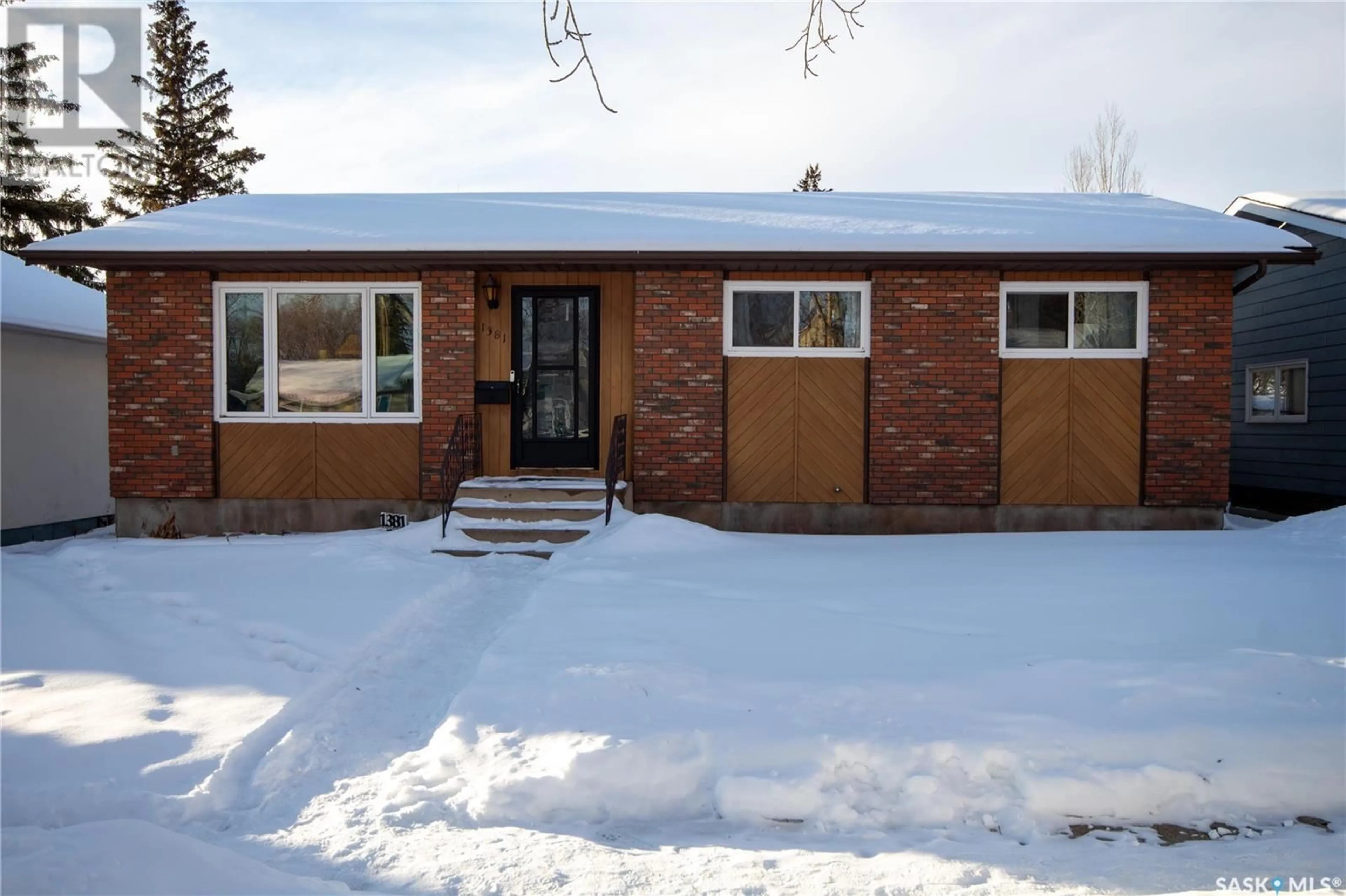 Home with brick exterior material, street for 1381 95th STREET, North Battleford Saskatchewan S9A0G3