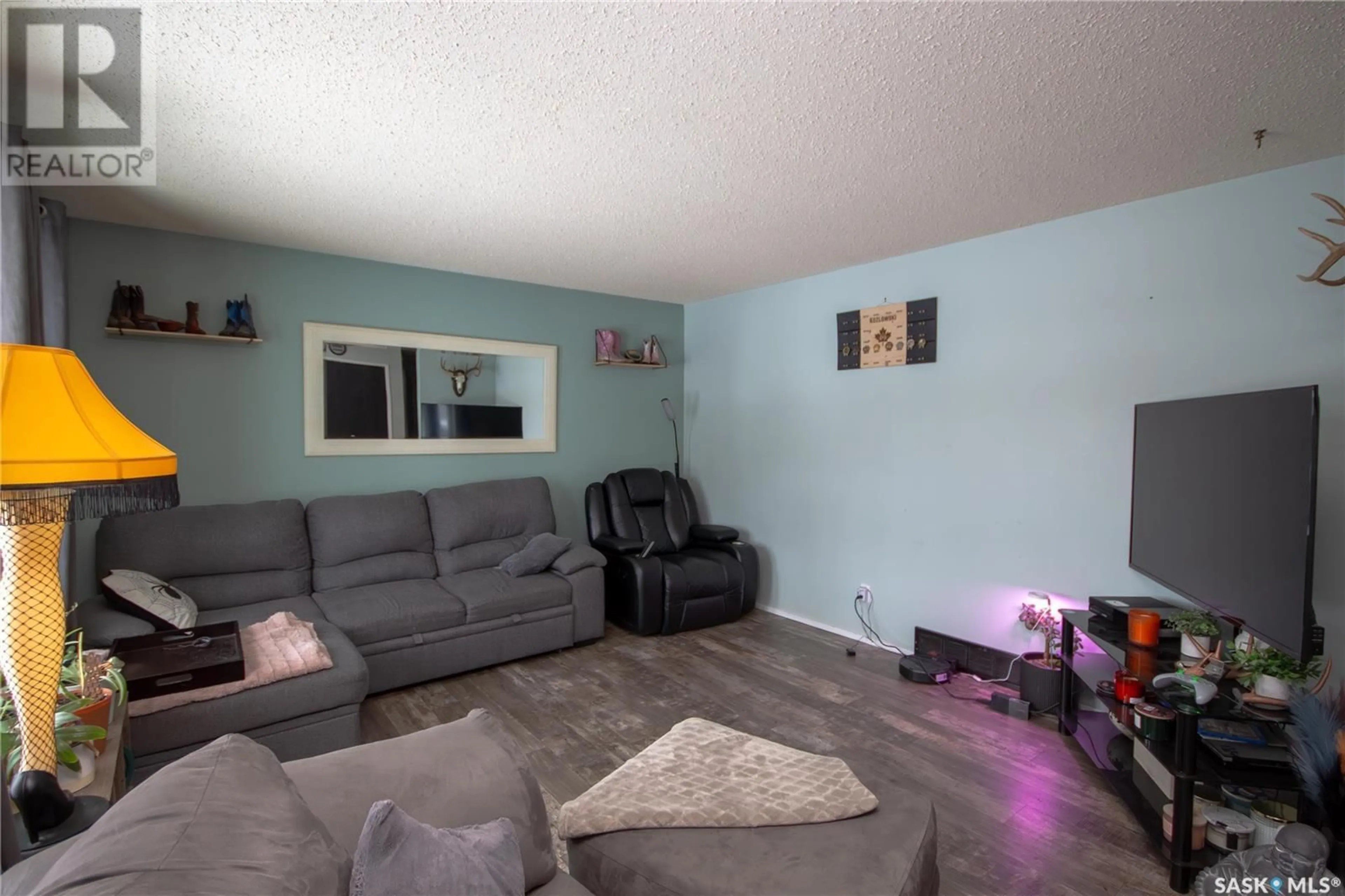 Living room with furniture, unknown for 1381 95th STREET, North Battleford Saskatchewan S9A0G3