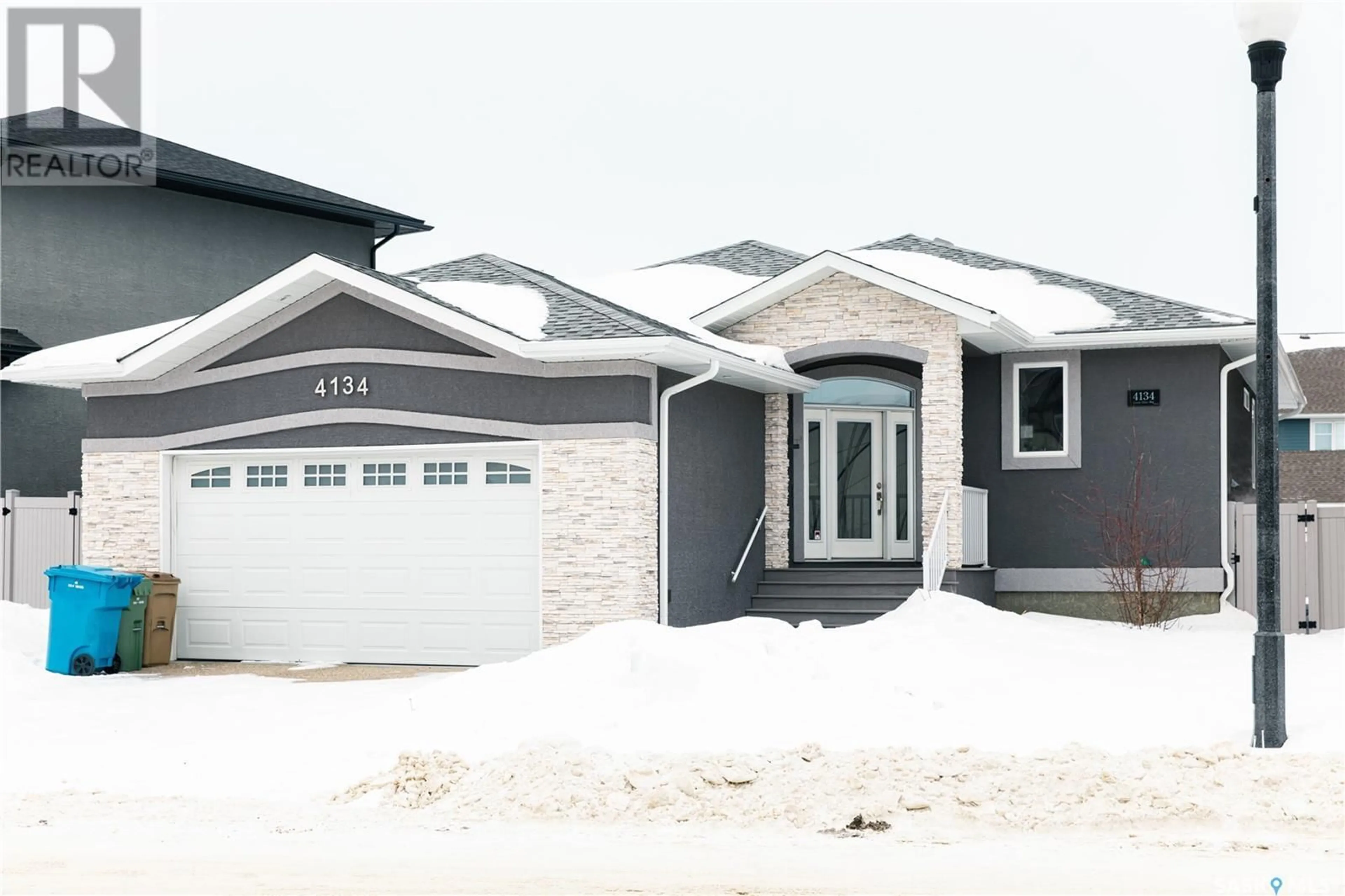 Home with vinyl exterior material, street for 4134 Green Olive WAY E, Regina Saskatchewan S4V1P8