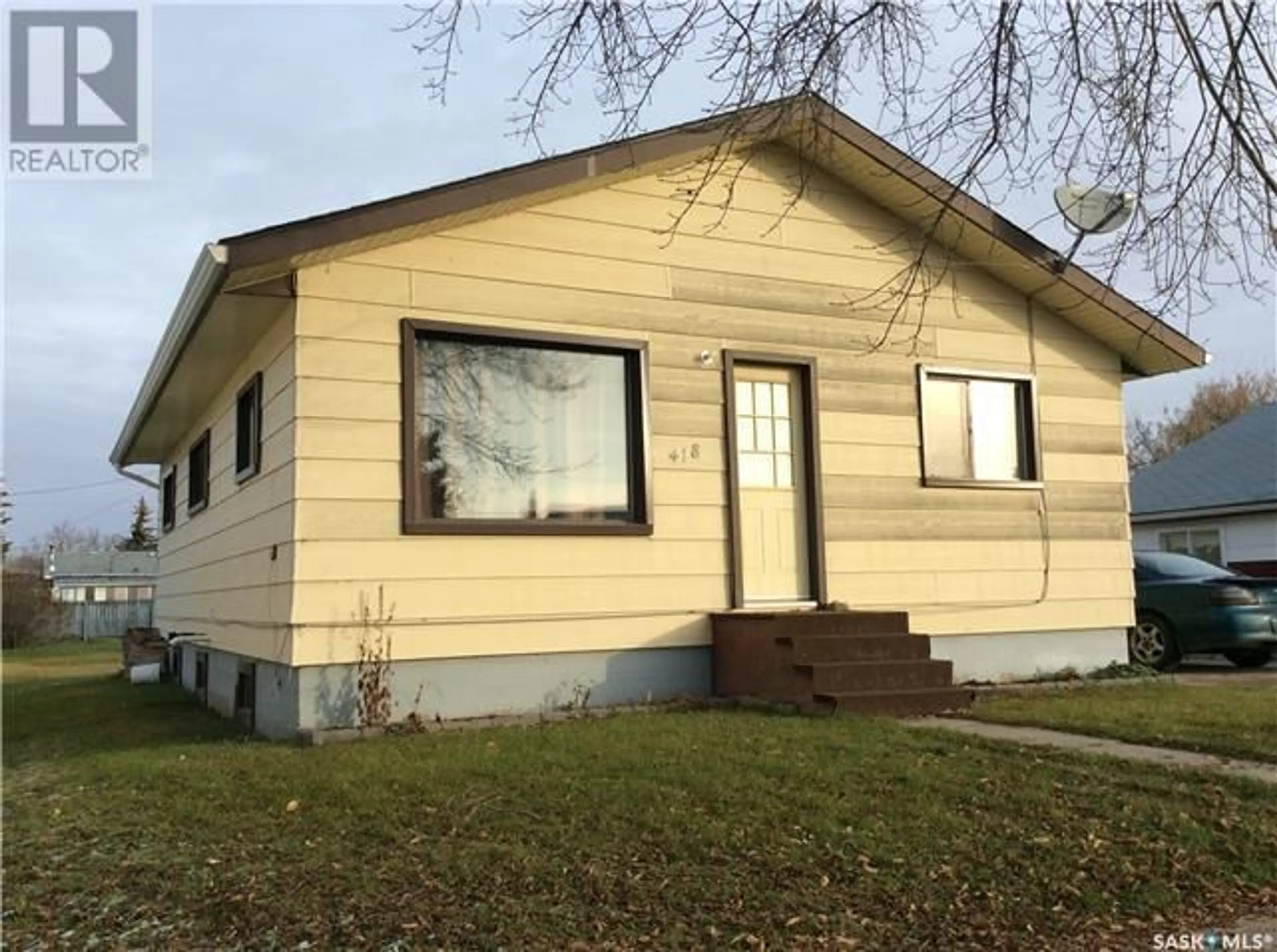 Home with vinyl exterior material, street for 418 1st STREET S, Wakaw Saskatchewan S0K4P0