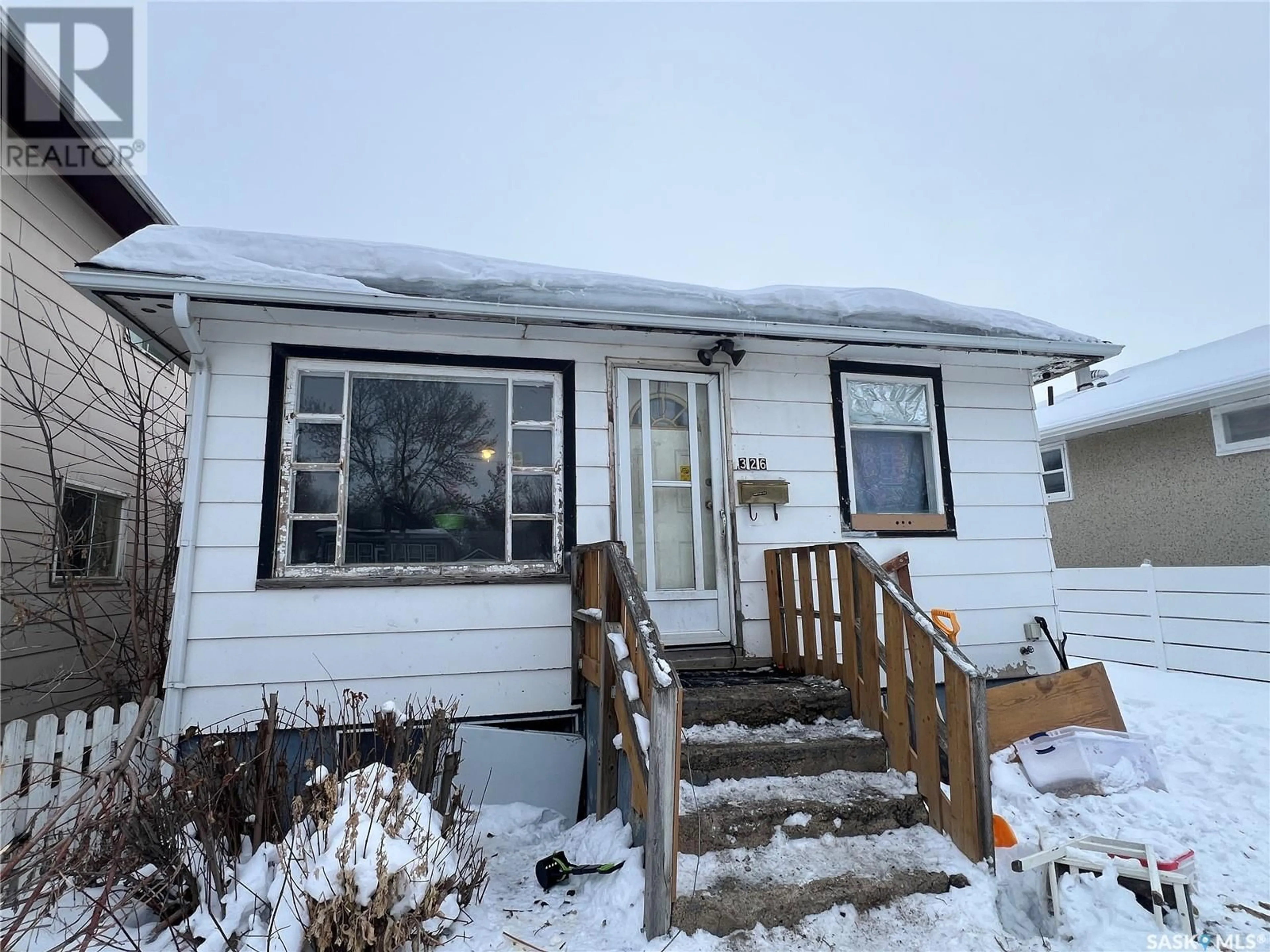 Home with vinyl exterior material, street for 326 T AVENUE S, Saskatoon Saskatchewan S7M3B1