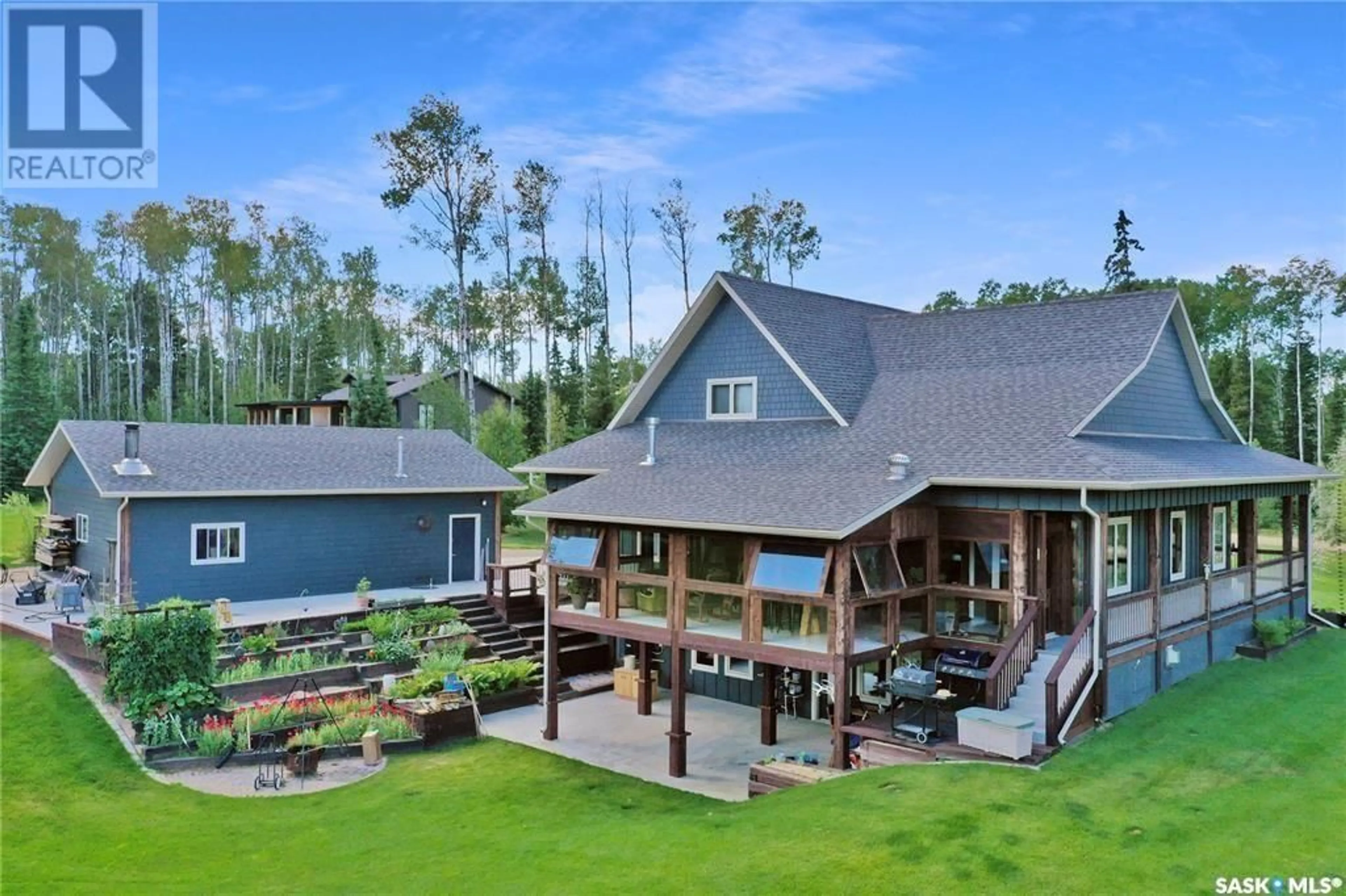 A pic from outside/outdoor area/front of a property/back of a property/a pic from drone, water/lake/river/ocean view for 303 MEADOW RIDGE DRIVE, Candle Lake Saskatchewan S0J3E0