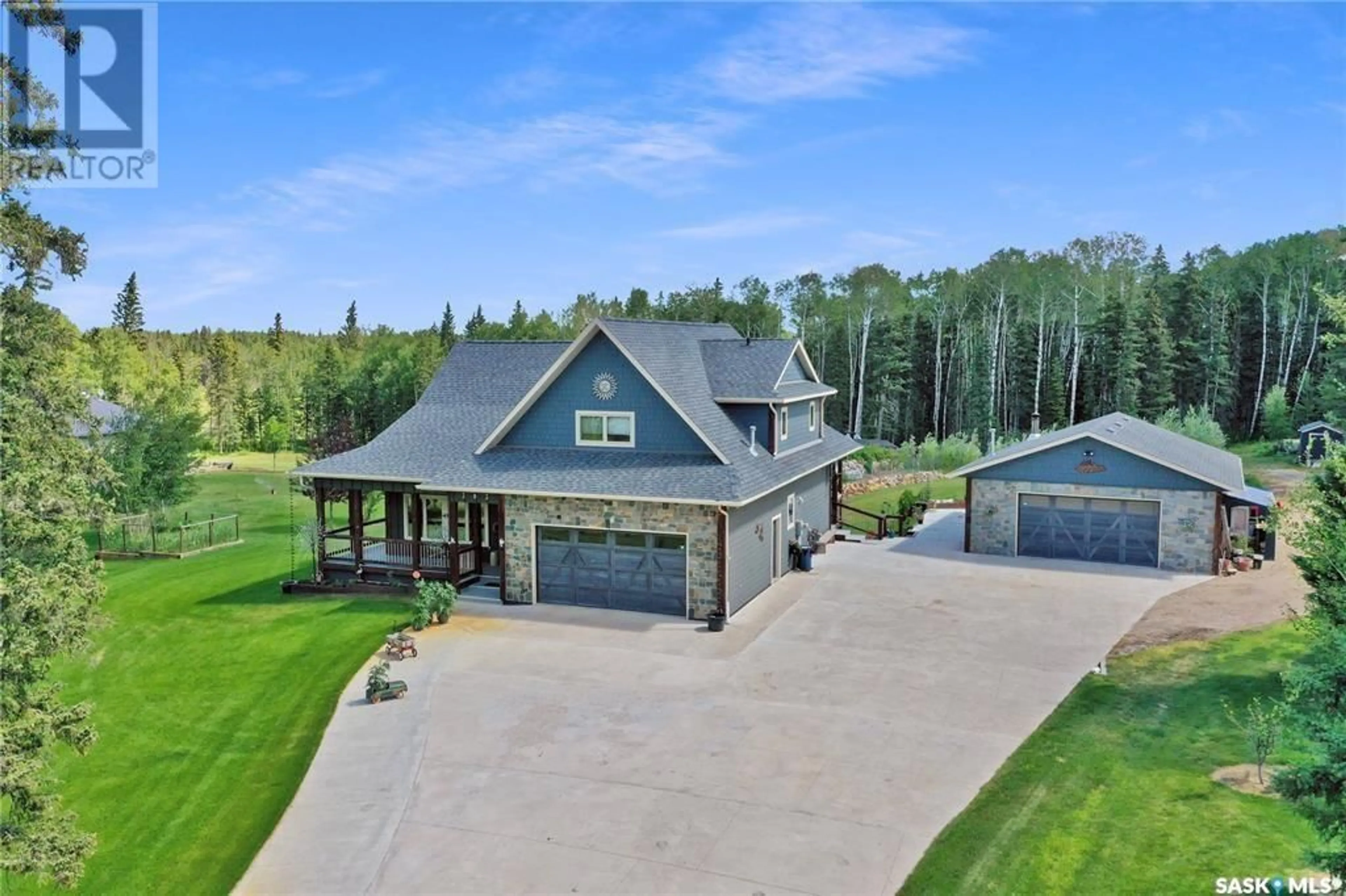 A pic from outside/outdoor area/front of a property/back of a property/a pic from drone, unknown for 303 Meadow Ridge DRIVE, Candle Lake Saskatchewan S0J3E0