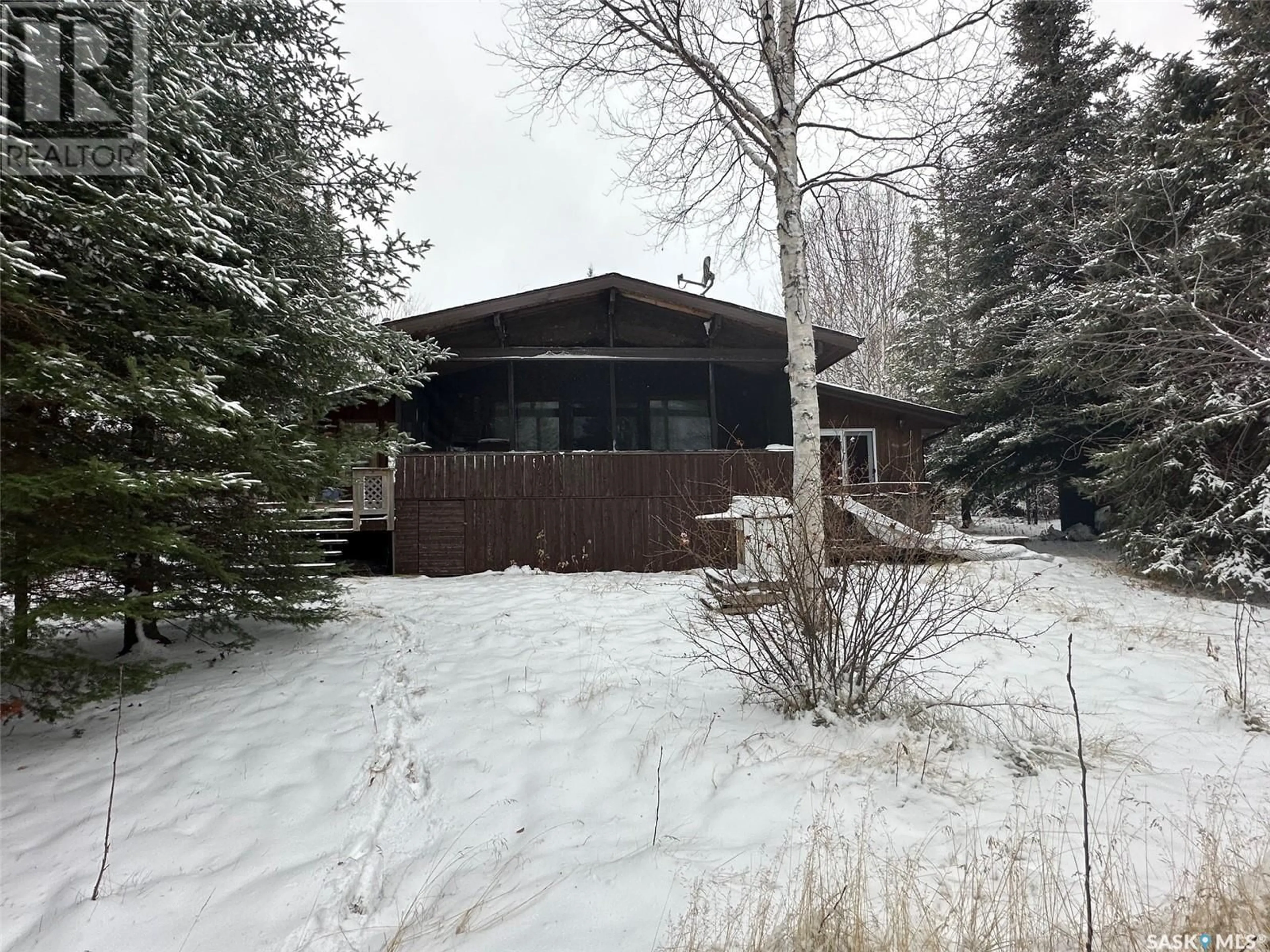 A pic from outside/outdoor area/front of a property/back of a property/a pic from drone, unknown for 1010 Waskos DRIVE, Lac La Ronge Saskatchewan S0J3G0