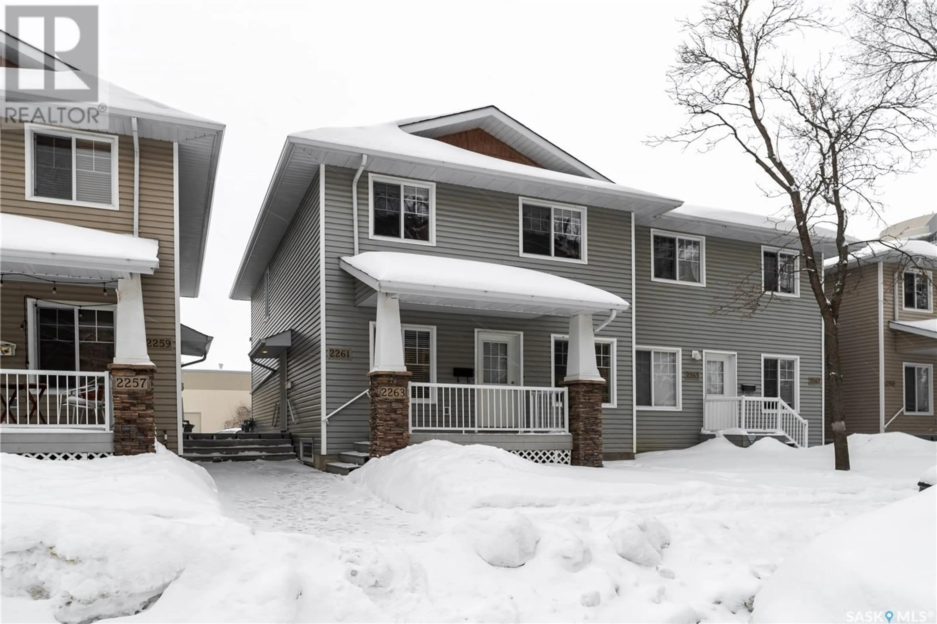 Home with vinyl exterior material, street for 2263 Treetop LANE, Regina Saskatchewan S4P4V8