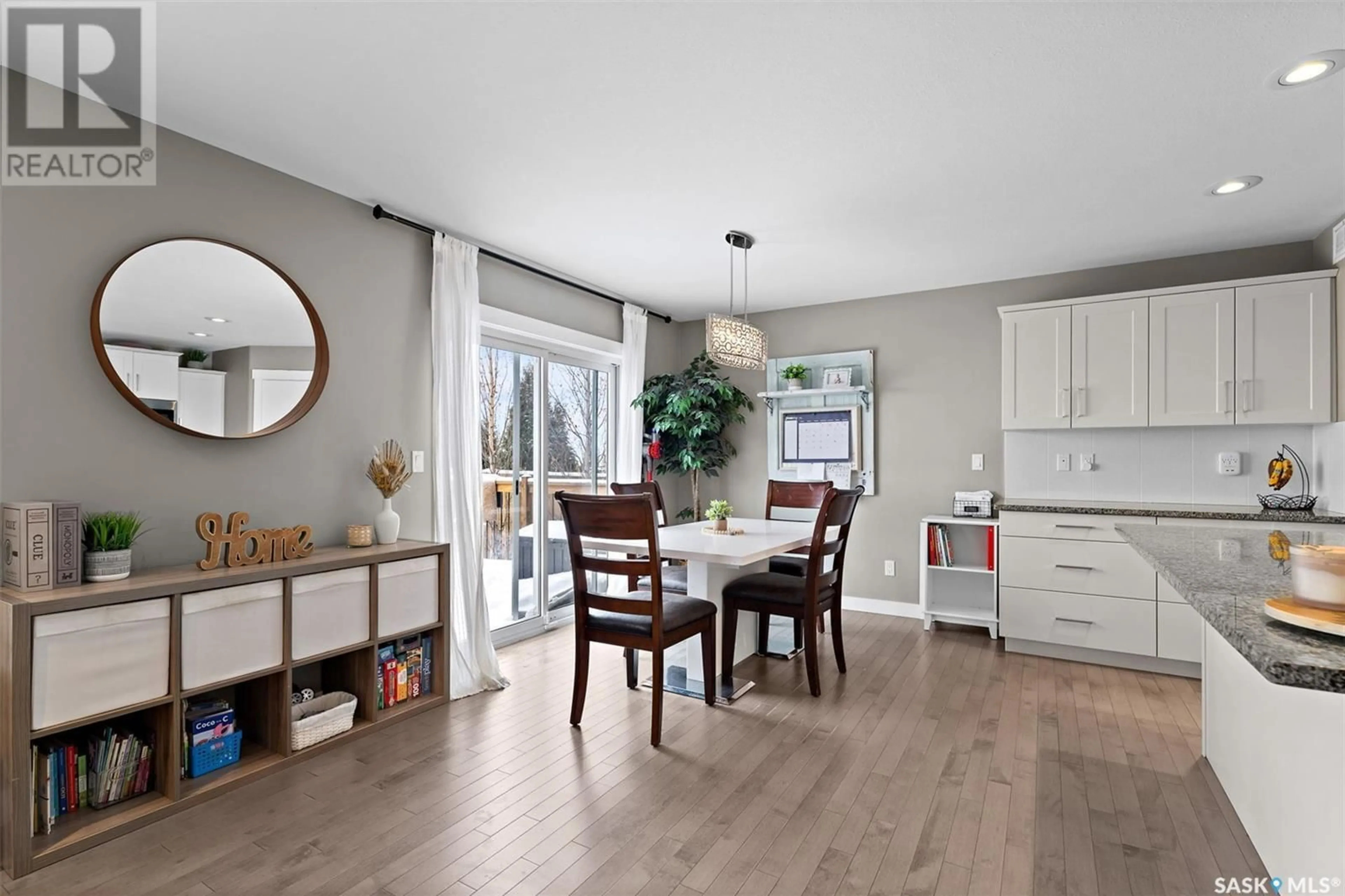 Open concept kitchen, wood/laminate floor for 430 Marlatte CRESCENT, Saskatoon Saskatchewan S7W0S9