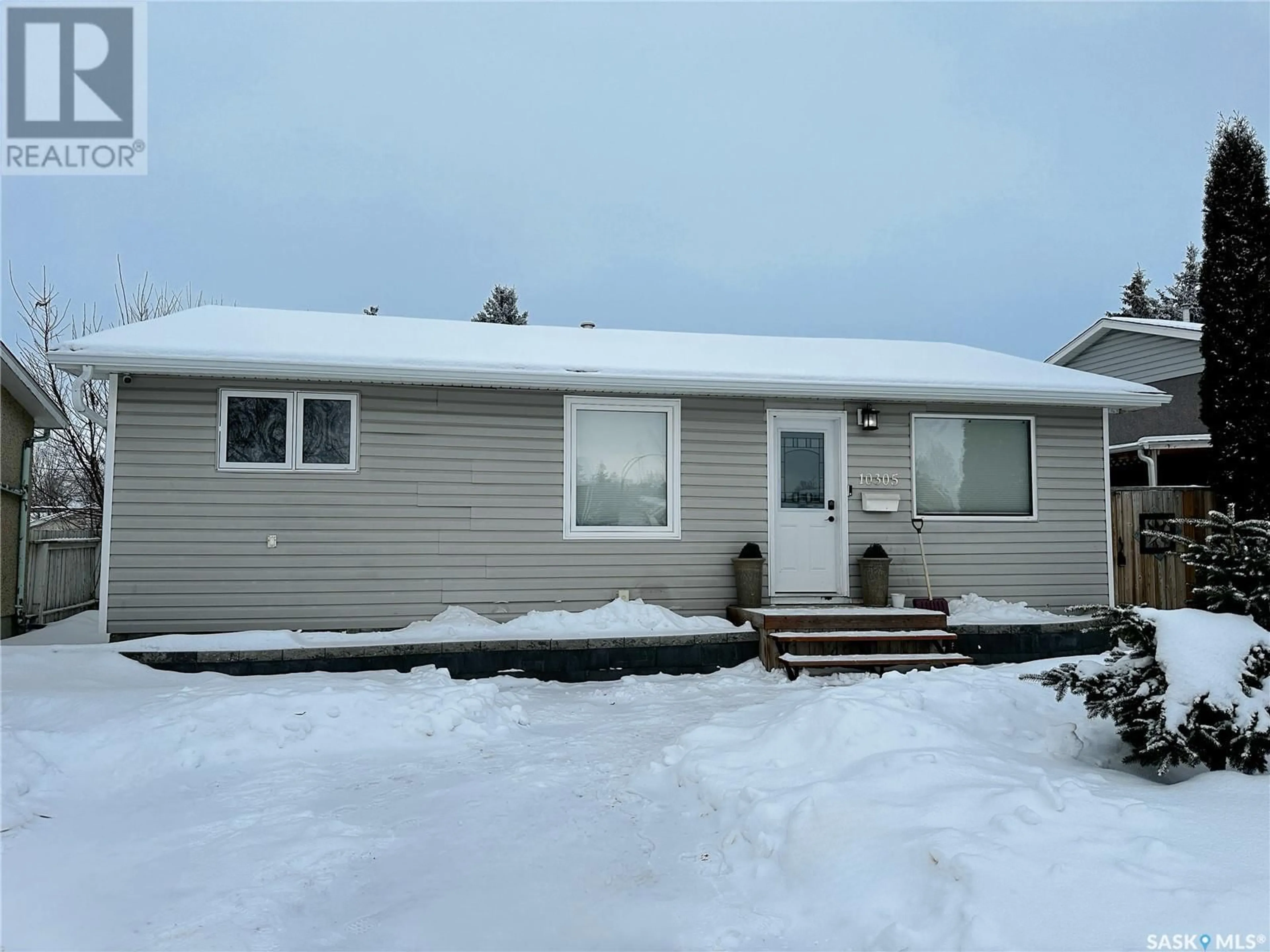 Home with vinyl exterior material, street for 10305 Laurier CRESCENT, North Battleford Saskatchewan S9A3A5