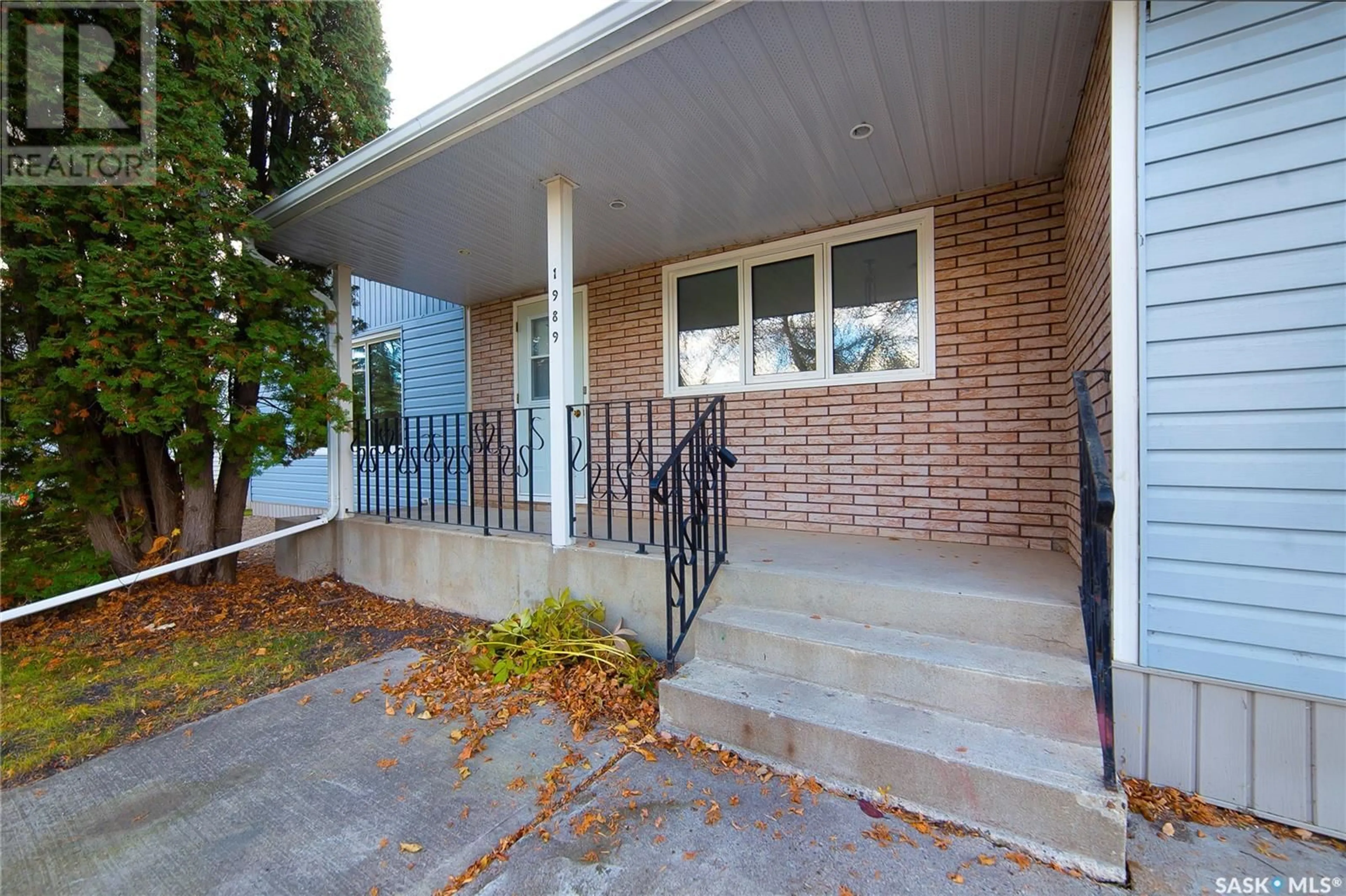 Home with brick exterior material, street for 1989 New Market DRIVE, Tisdale Saskatchewan S0E1T0