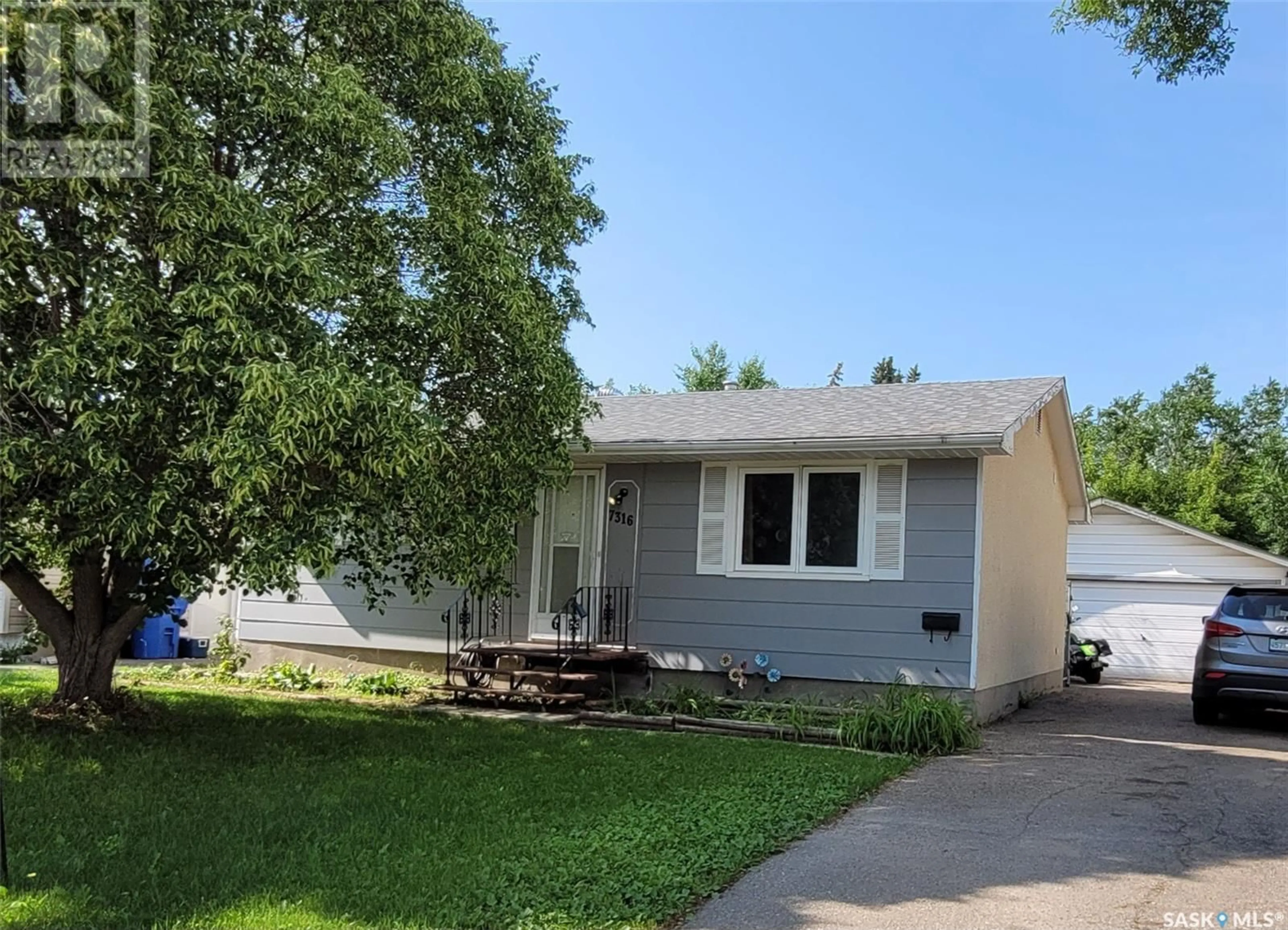 Home with vinyl exterior material, street for 7316 6TH AVENUE, Regina Saskatchewan S4T0P2