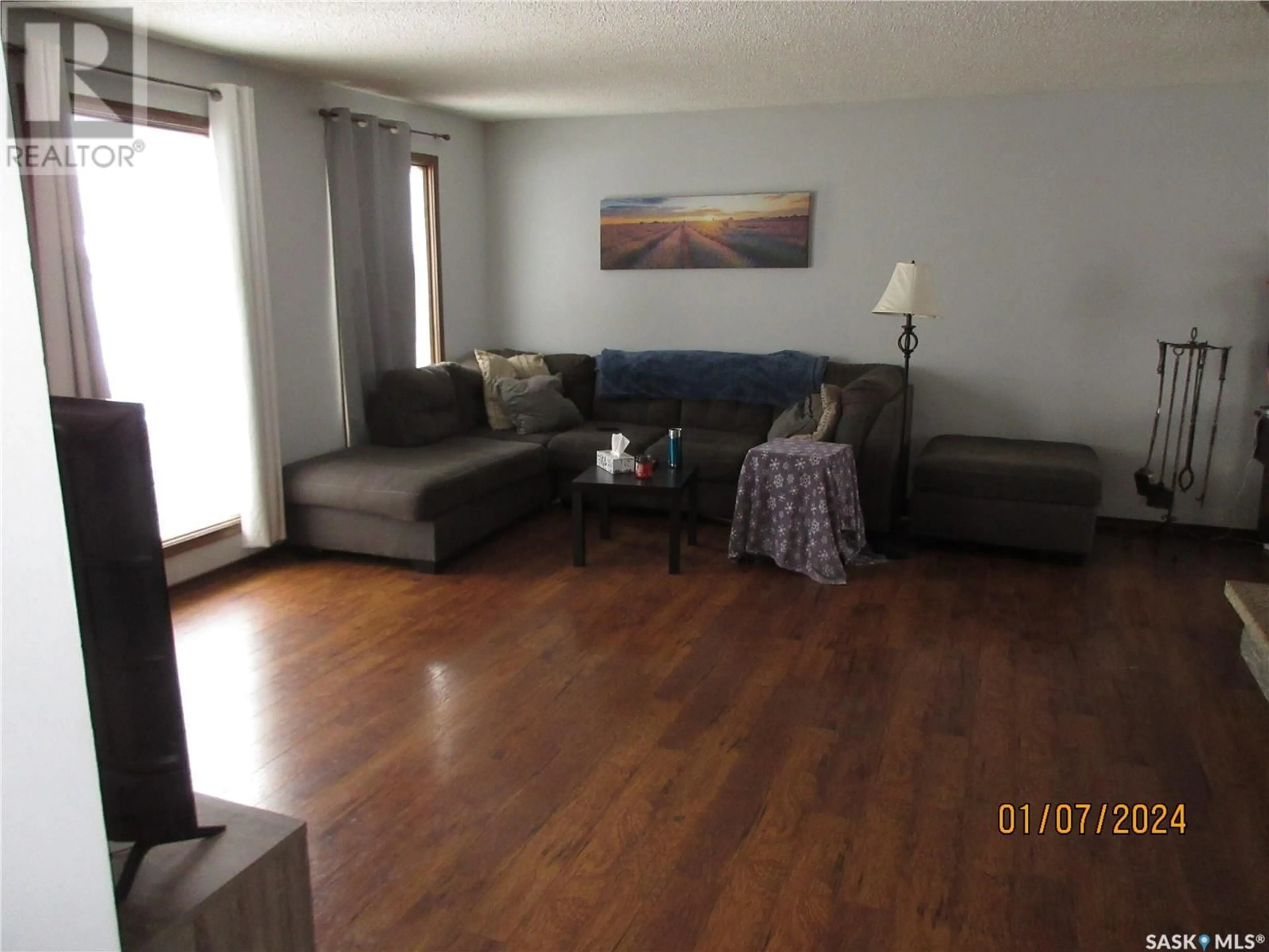 Living room with furniture, wood/laminate floor for 59 ANDRE AVENUE, Regina Saskatchewan S4T7C9