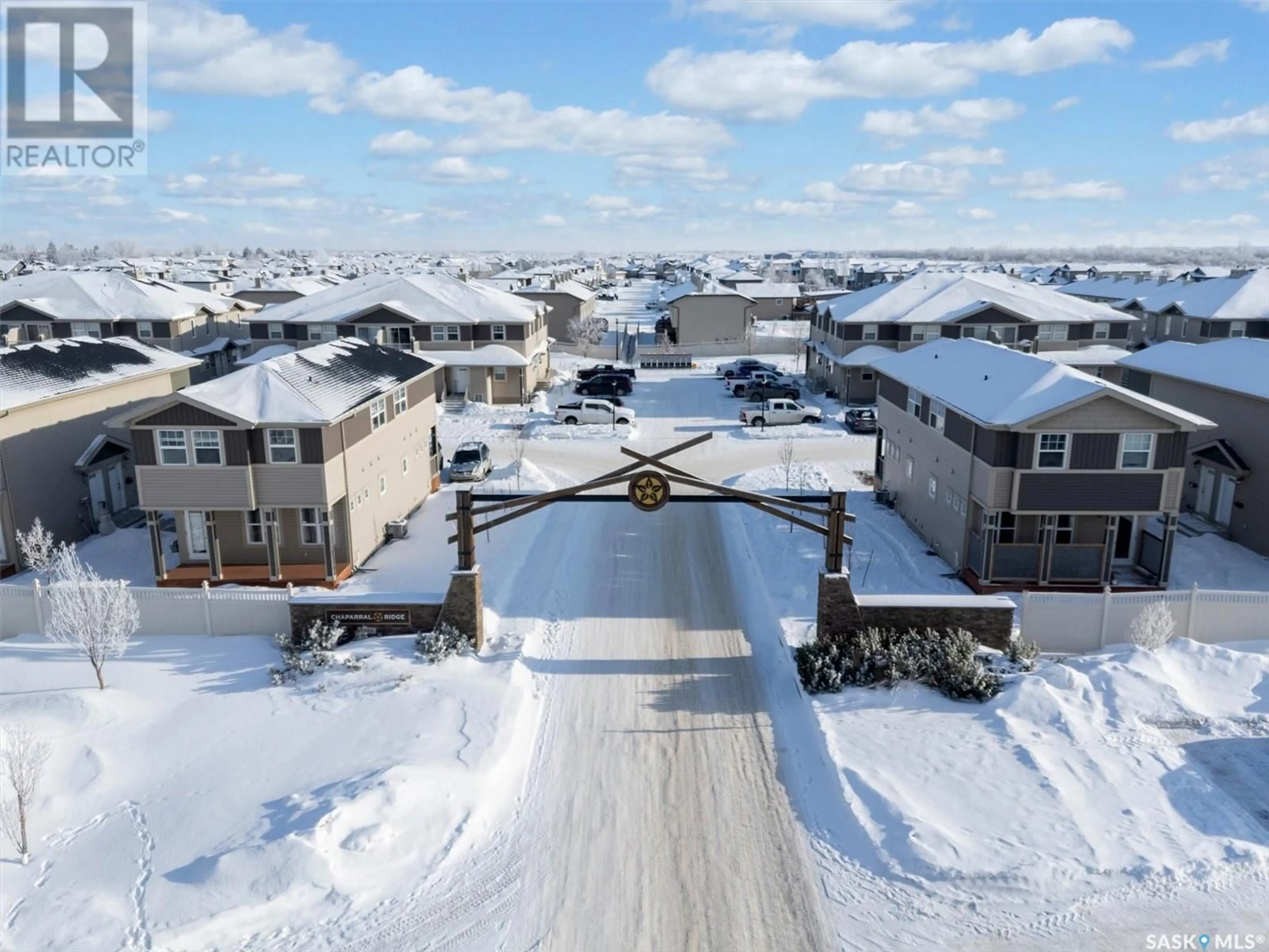 A pic from outside/outdoor area/front of a property/back of a property/a pic from drone, street for 219 100 Chaparral BOULEVARD, Martensville Saskatchewan S0K0A2