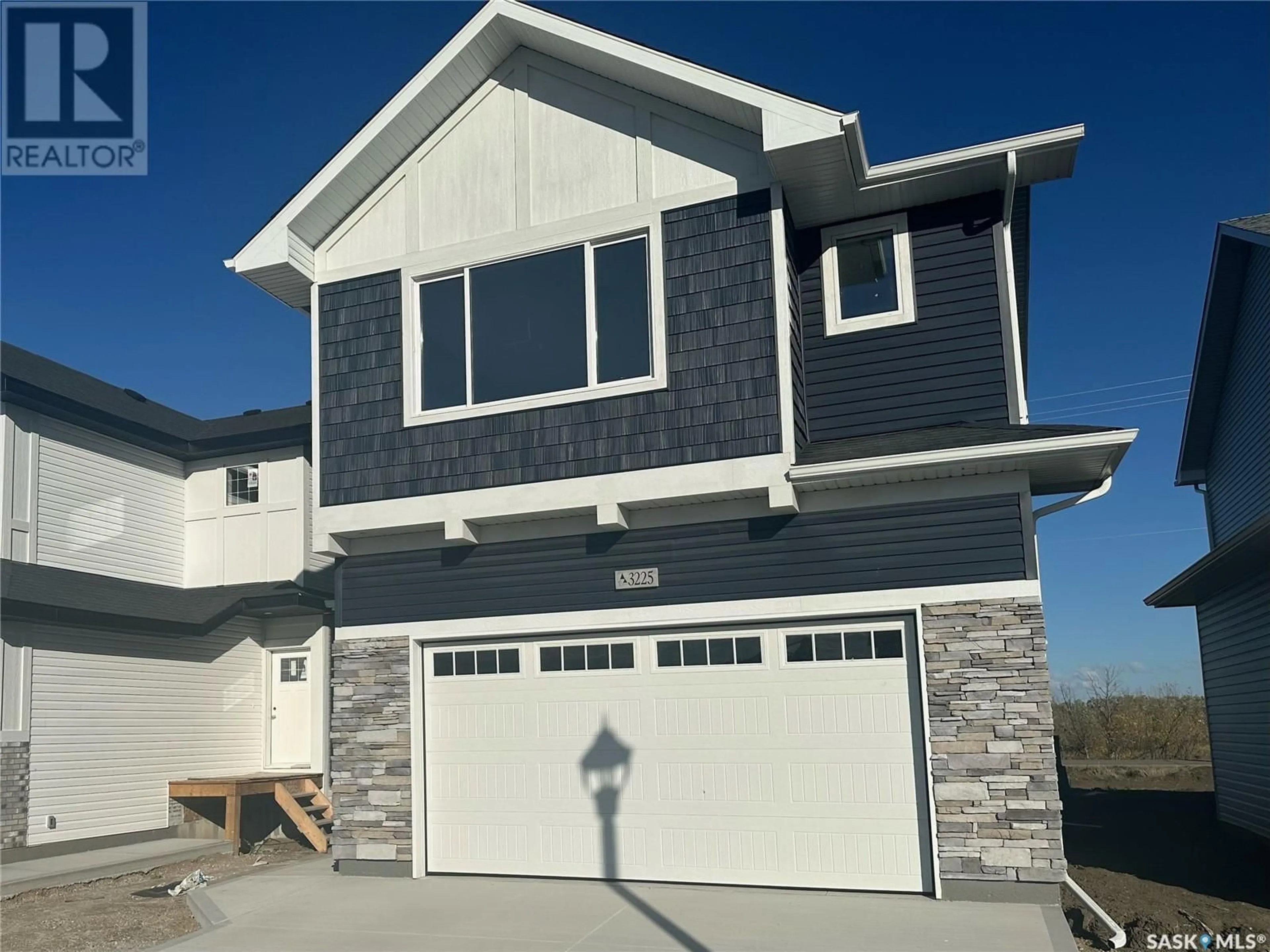 Home with vinyl exterior material, street for 3225 Green Turtle ROAD, Regina Saskatchewan S4V4B4