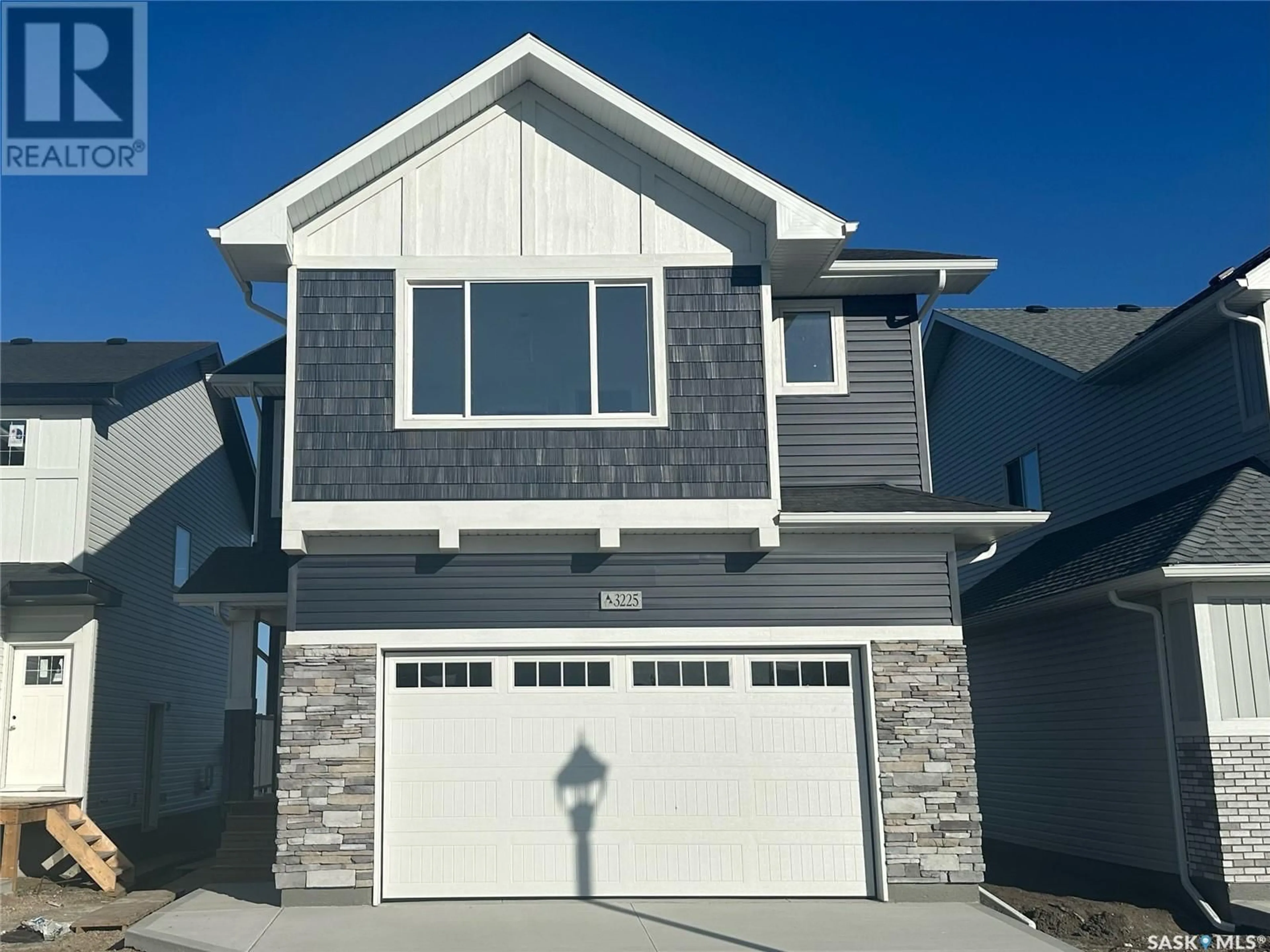 Home with vinyl exterior material, street for 3225 Green Turtle ROAD, Regina Saskatchewan S4V4B4