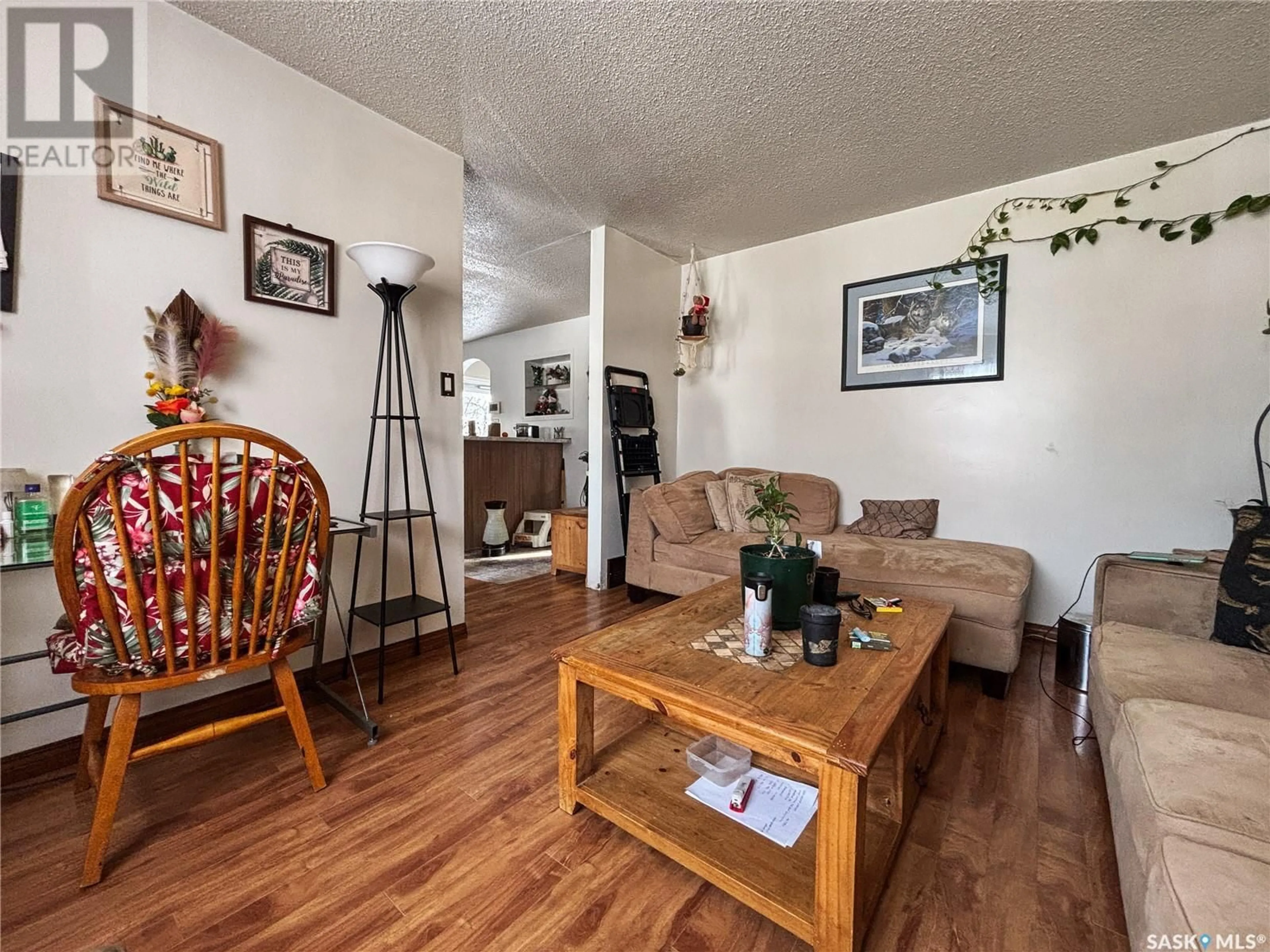 Living room with furniture, wood/laminate floor for 17 Glenwood AVENUE, Saskatoon Saskatchewan S7L4A7