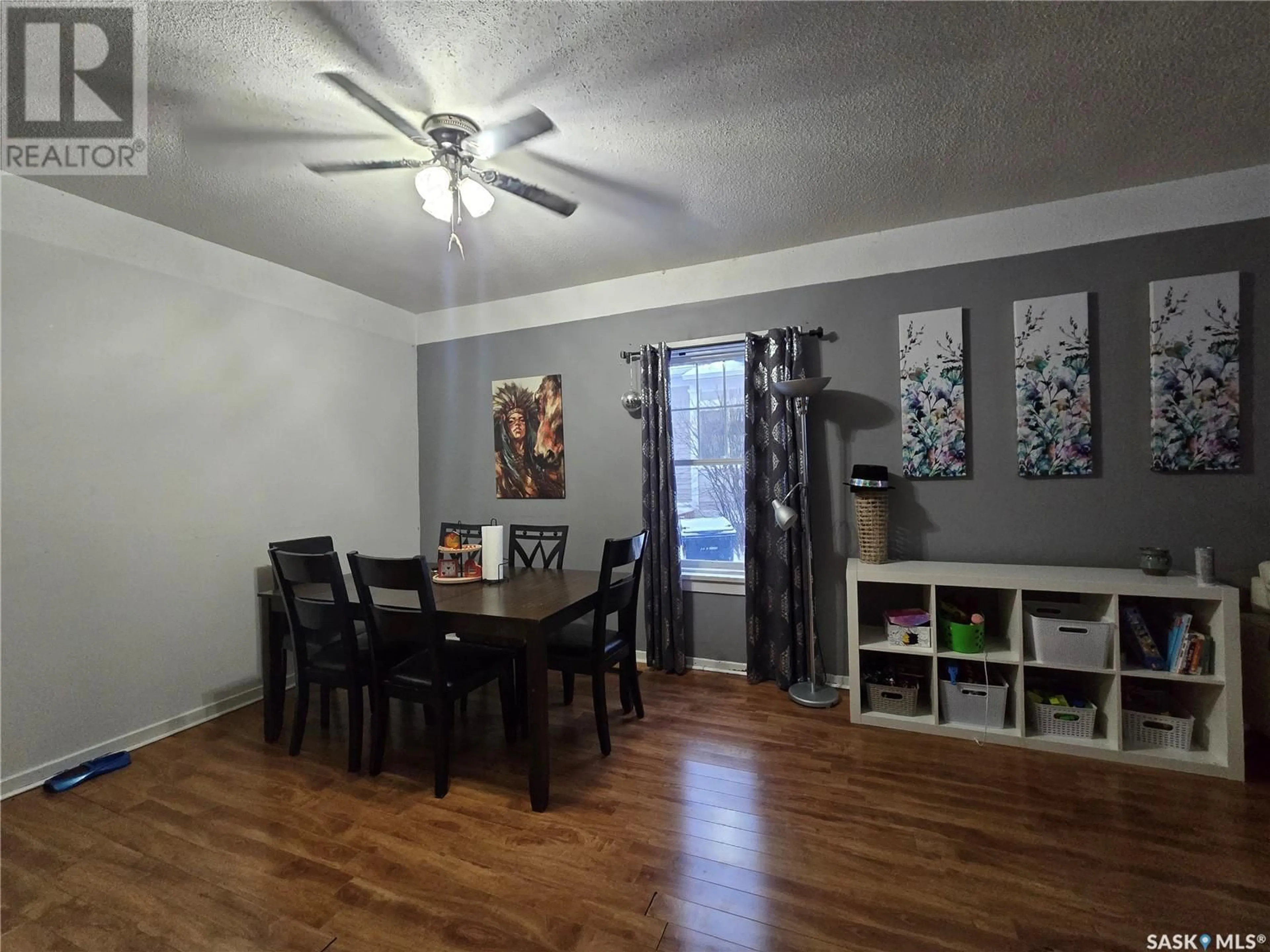 Dining room, wood/laminate floor for 1442 99th STREET, North Battleford Saskatchewan S9A0R1