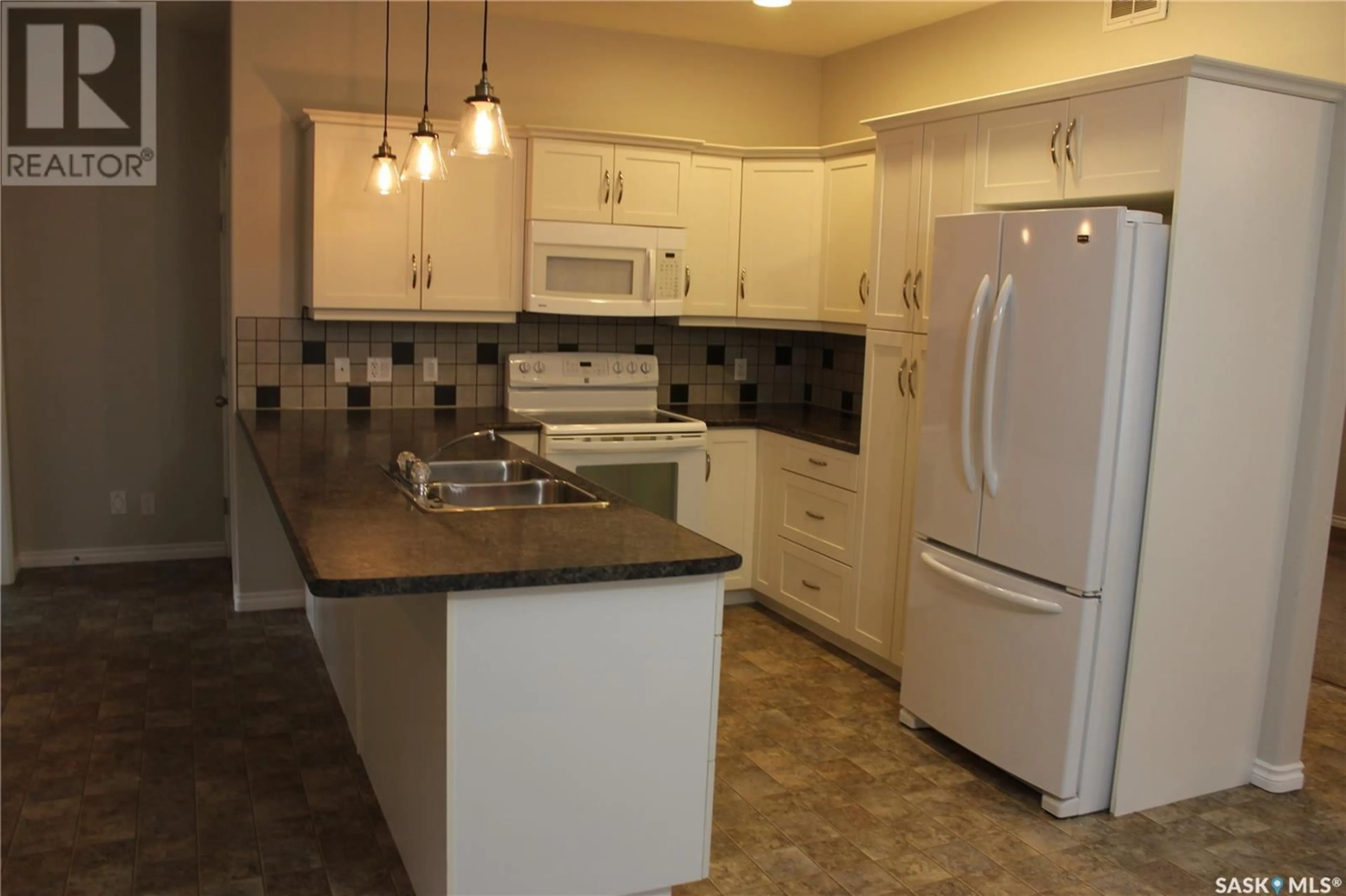 Standard kitchen, ceramic/tile floor for 106 Erickson STREET, Midale Saskatchewan S0C1S0