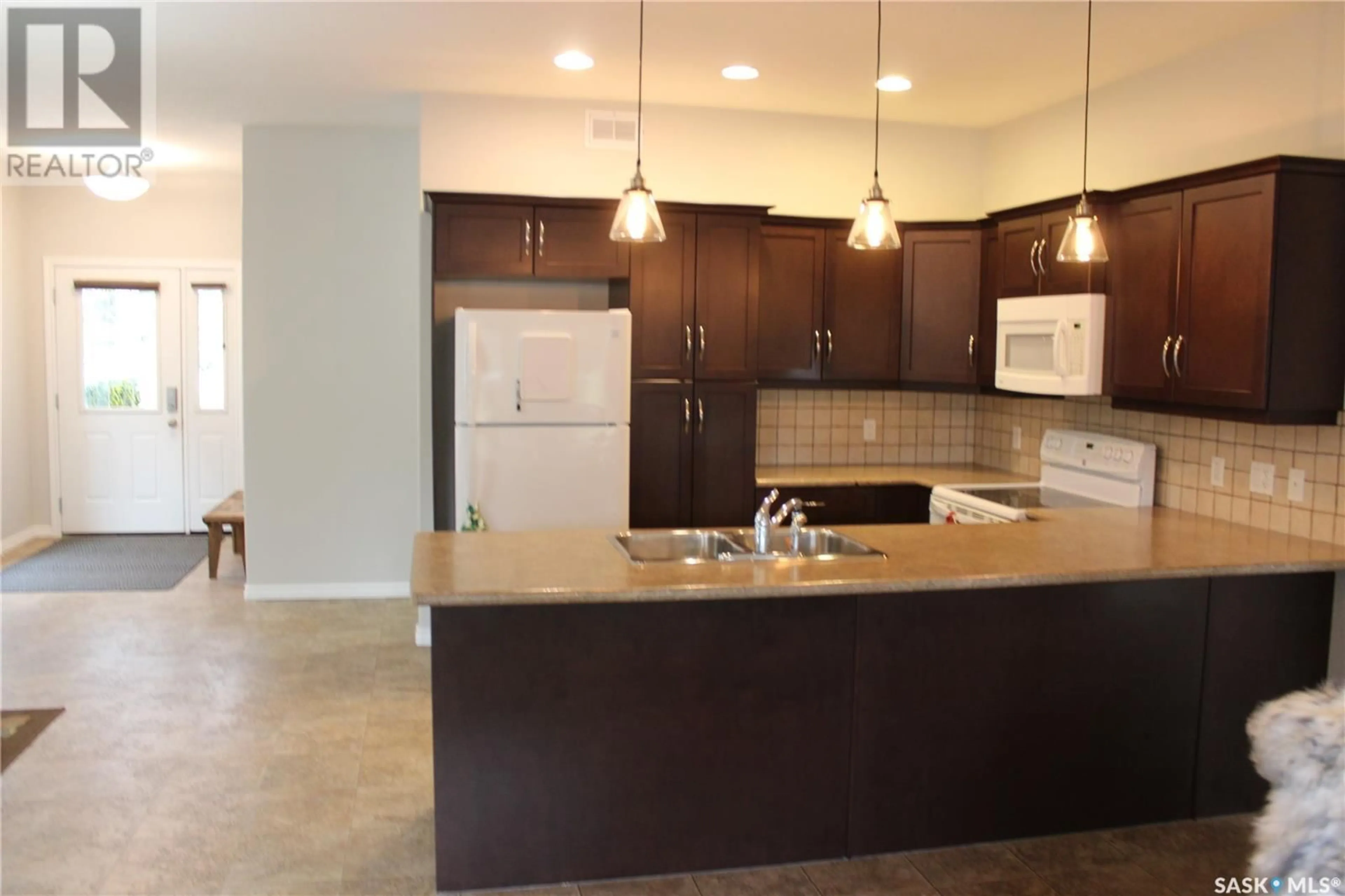 Open concept kitchen, ceramic/tile floor for 108 Erickson STREET, Midale Saskatchewan S0C1S0