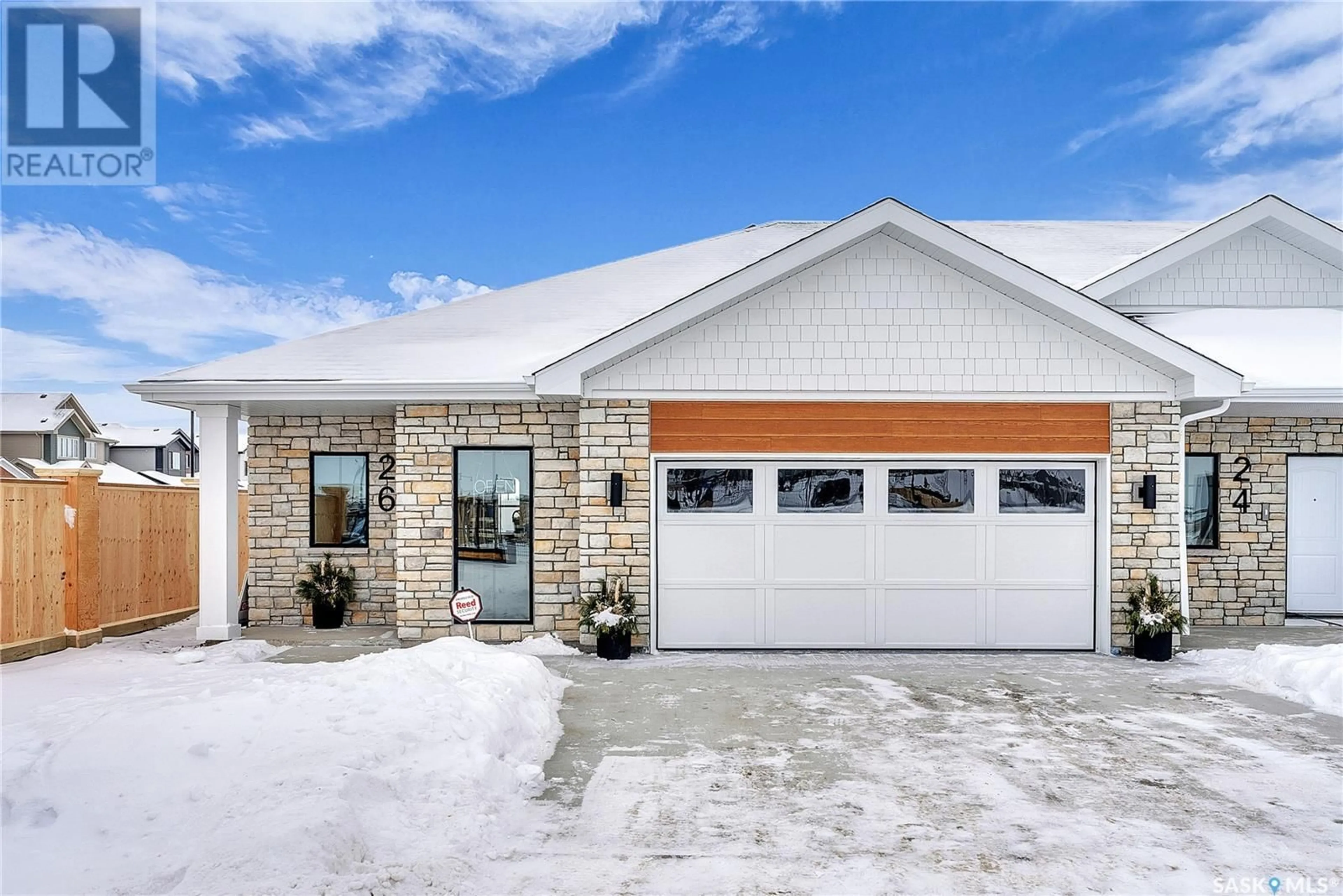 Home with brick exterior material, street for 24 BRIGHTON BOULEVARD, Saskatoon Saskatchewan S7V1X1