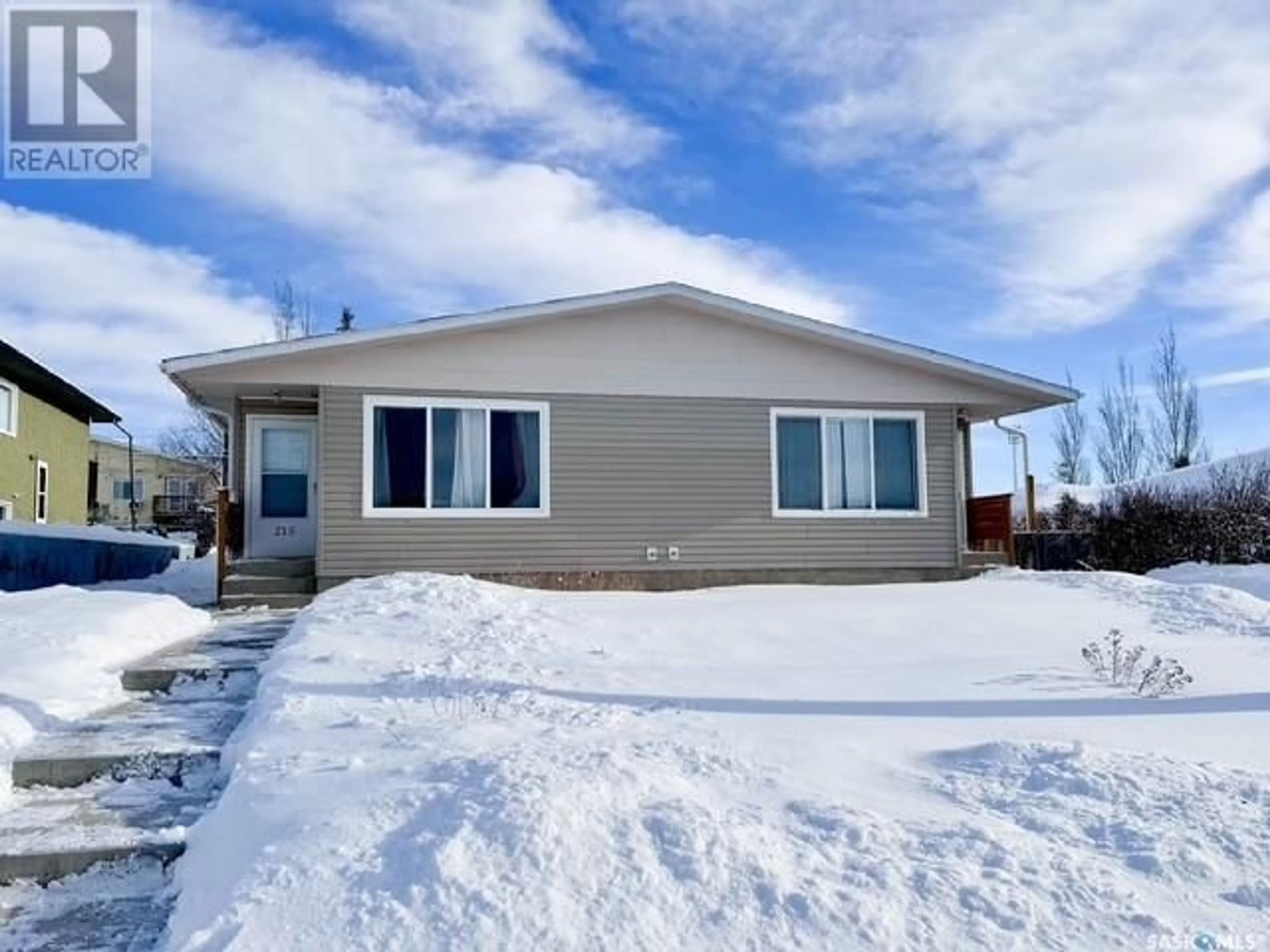 Home with vinyl exterior material, unknown for 211 & 215 18th AVENUE NE, Swift Current Saskatchewan S9H2Y2