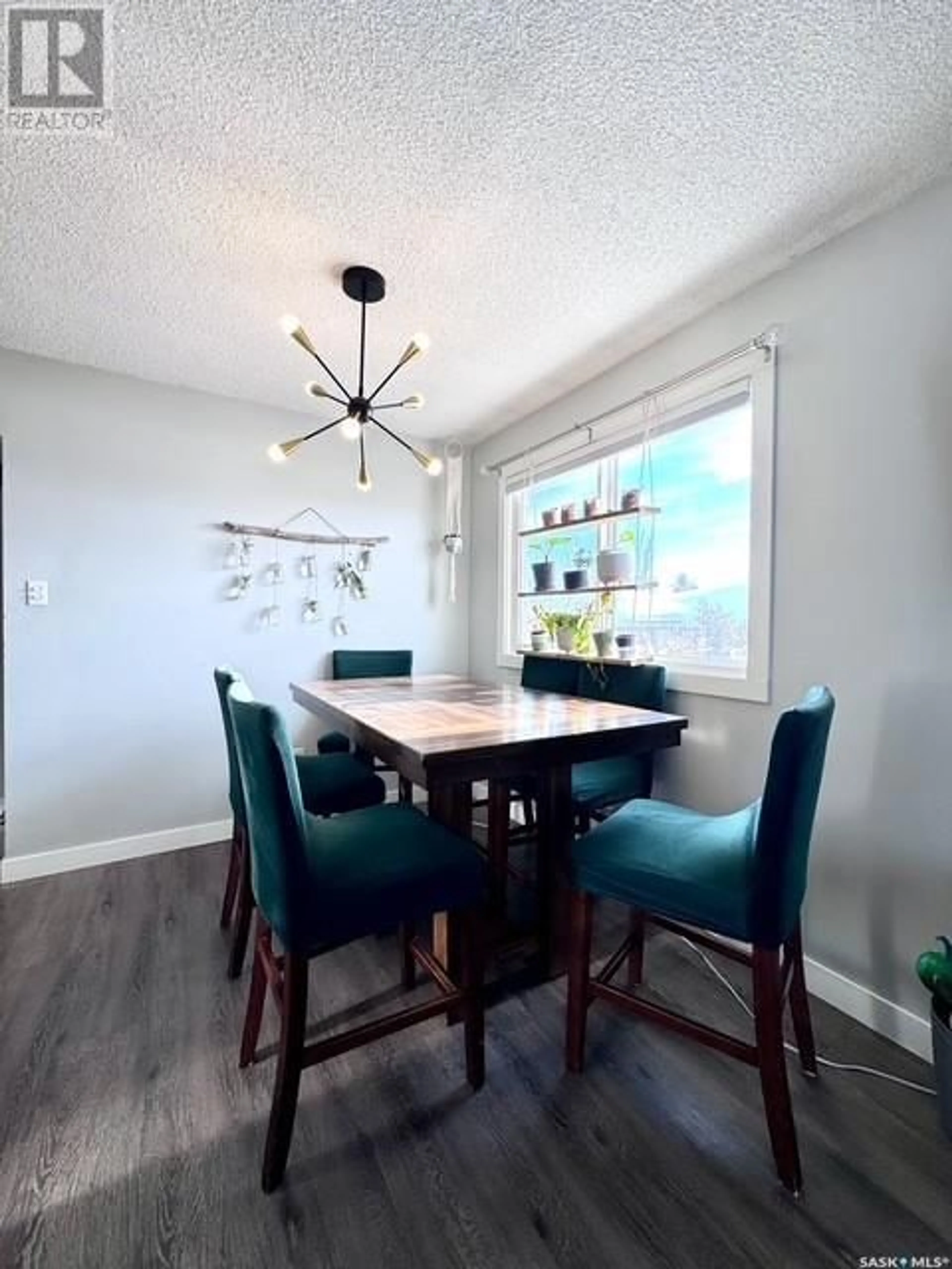 Dining room, wood/laminate floor for 211 & 215 18th AVENUE NE, Swift Current Saskatchewan S9H2Y2