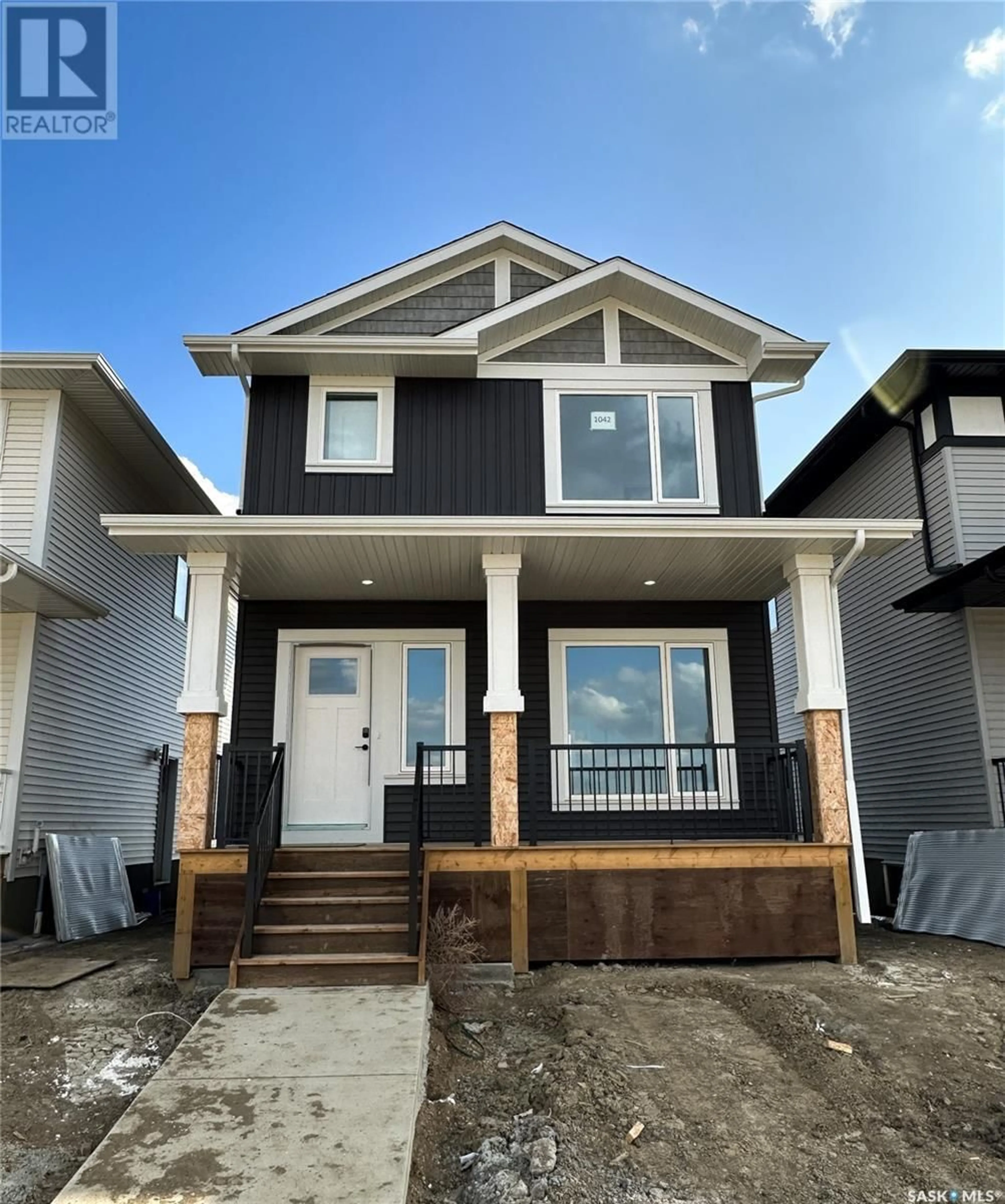 Home with vinyl exterior material, street for 748 Henry Dayday ROAD, Saskatoon Saskatchewan S7W1E2