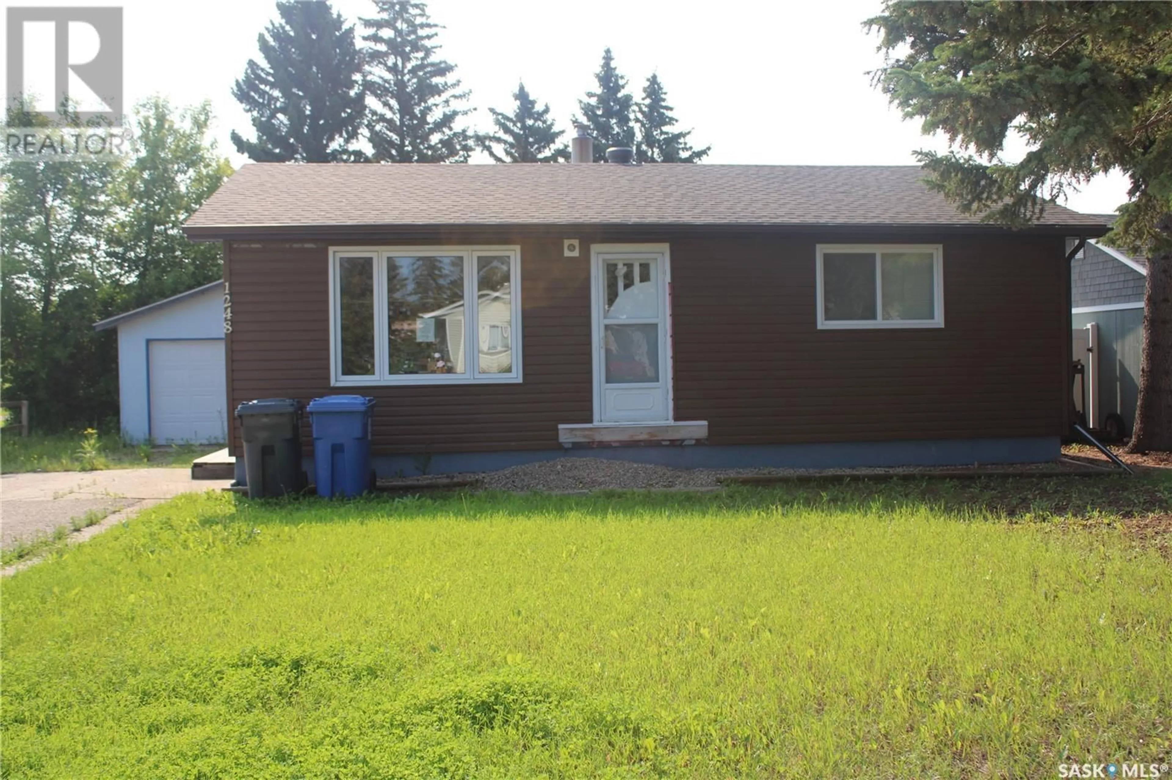 Home with vinyl exterior material, street for 1248 Main STREET, Melville Saskatchewan S0A2P0