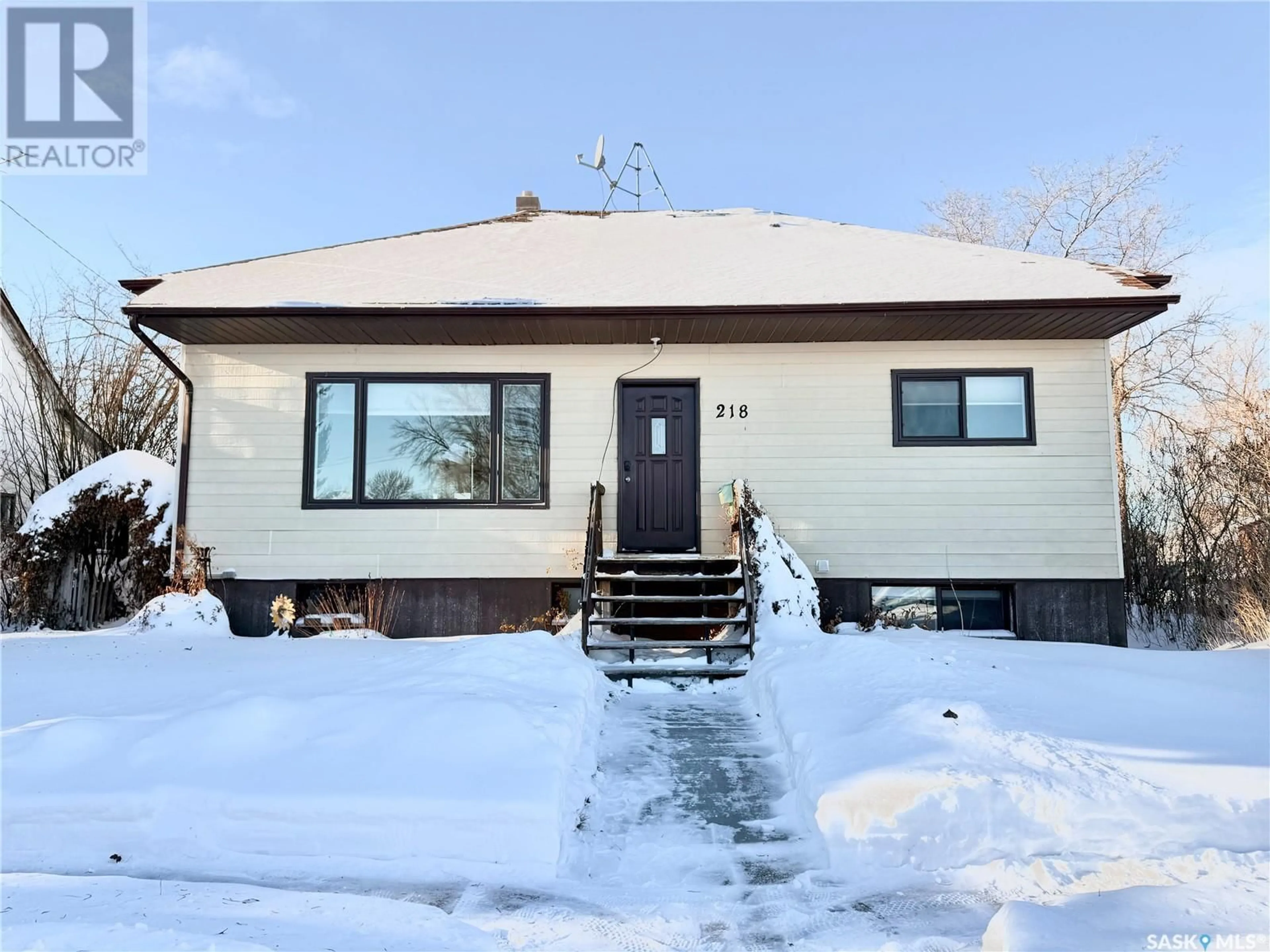 Home with vinyl exterior material, street for 218 Simpson STREET, Outlook Saskatchewan S0L2N0