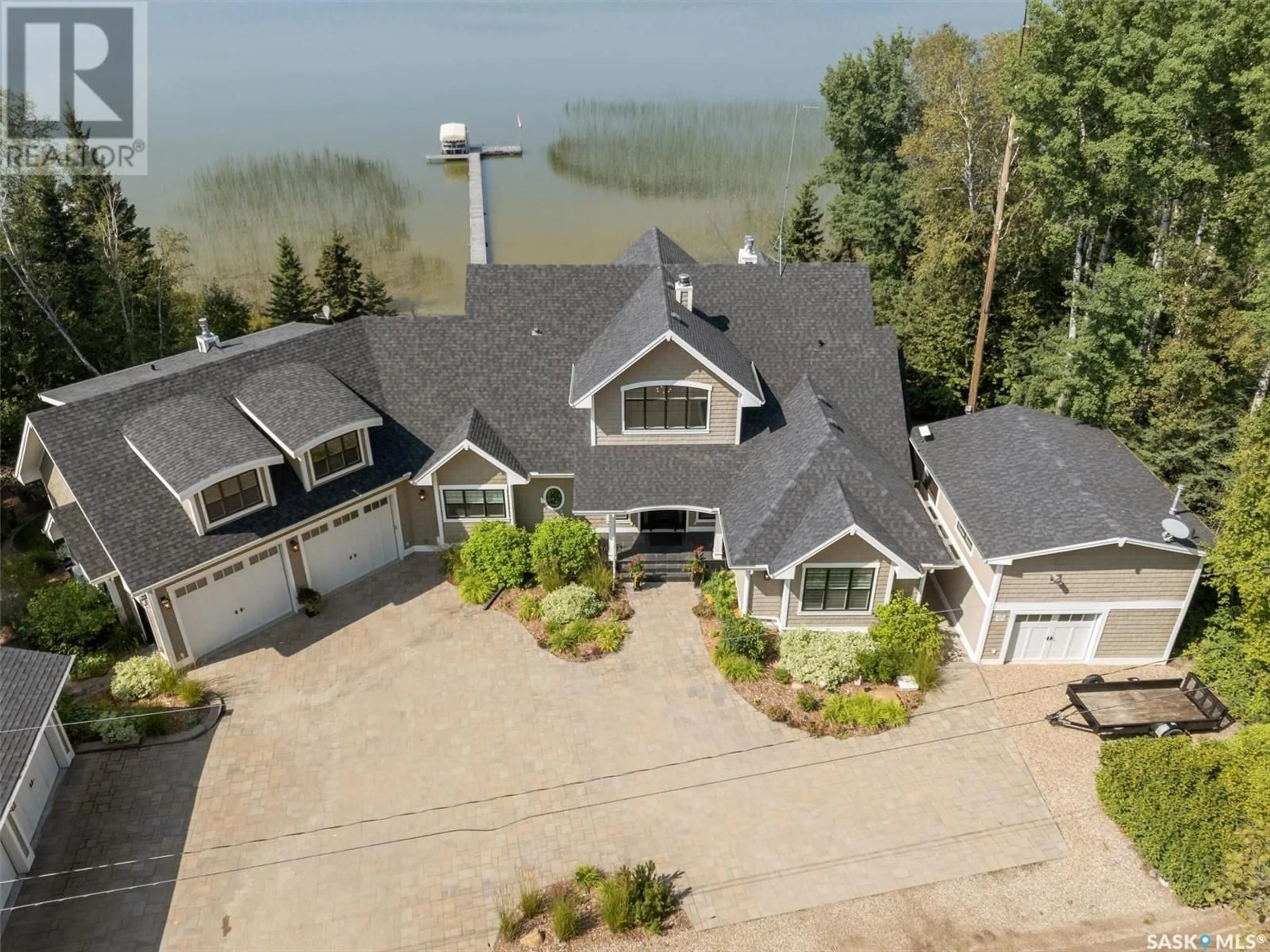 A pic from outside/outdoor area/front of a property/back of a property/a pic from drone, water/lake/river/ocean view for 210 Okema TRAIL, Emma Lake Saskatchewan S0J0N0