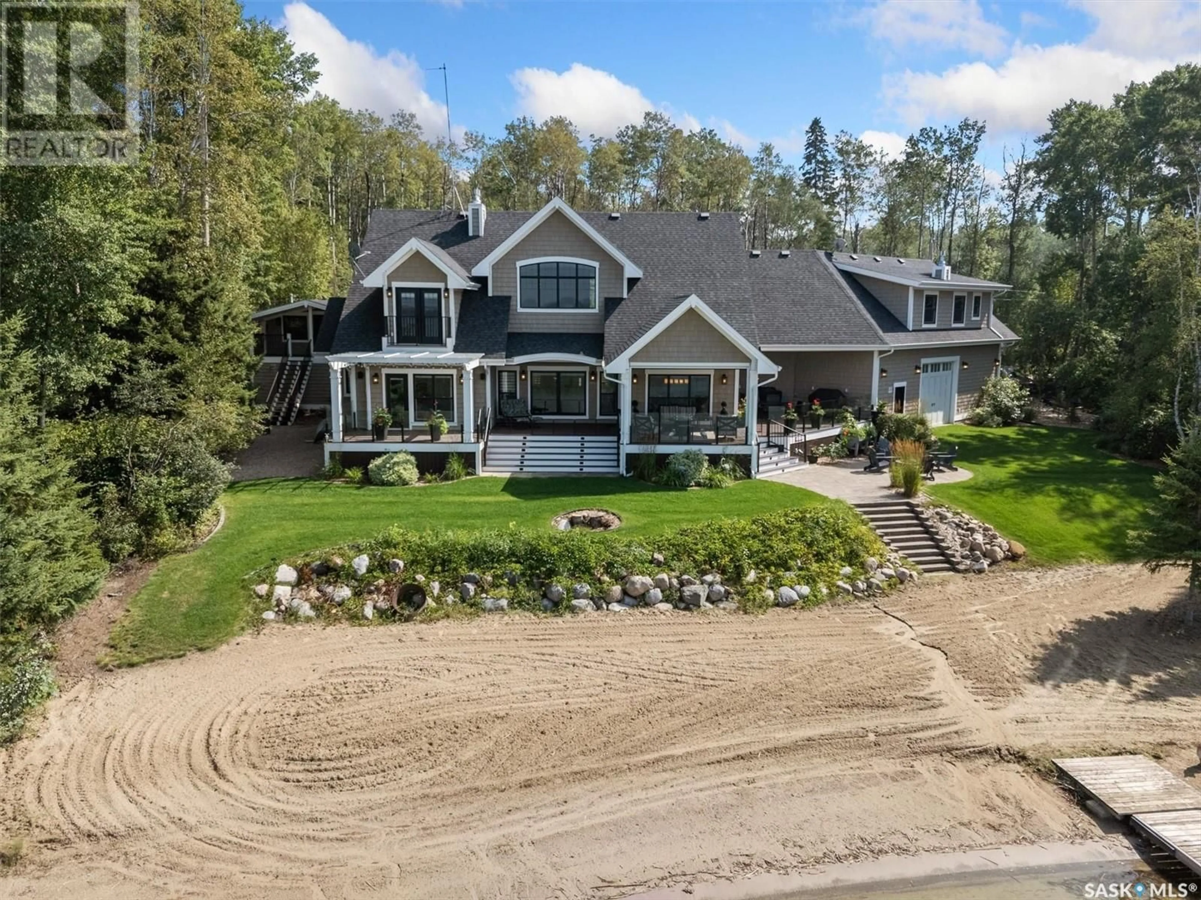 A pic from outside/outdoor area/front of a property/back of a property/a pic from drone, water/lake/river/ocean view for 210 Okema TRAIL, Emma Lake Saskatchewan S0J0N0